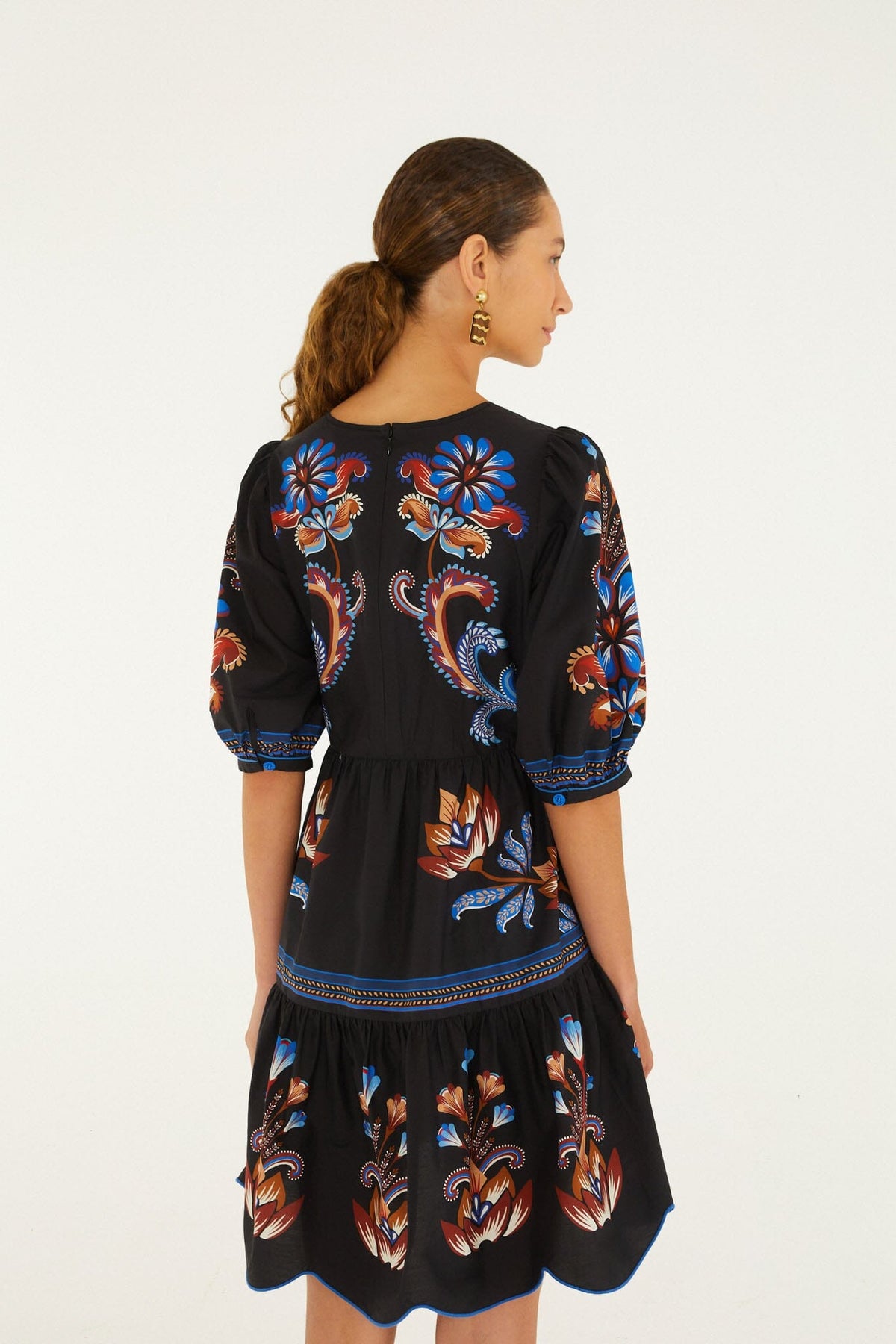 FARM Rio model wearing the Energy Floral Ruffled Hem Mini Dress