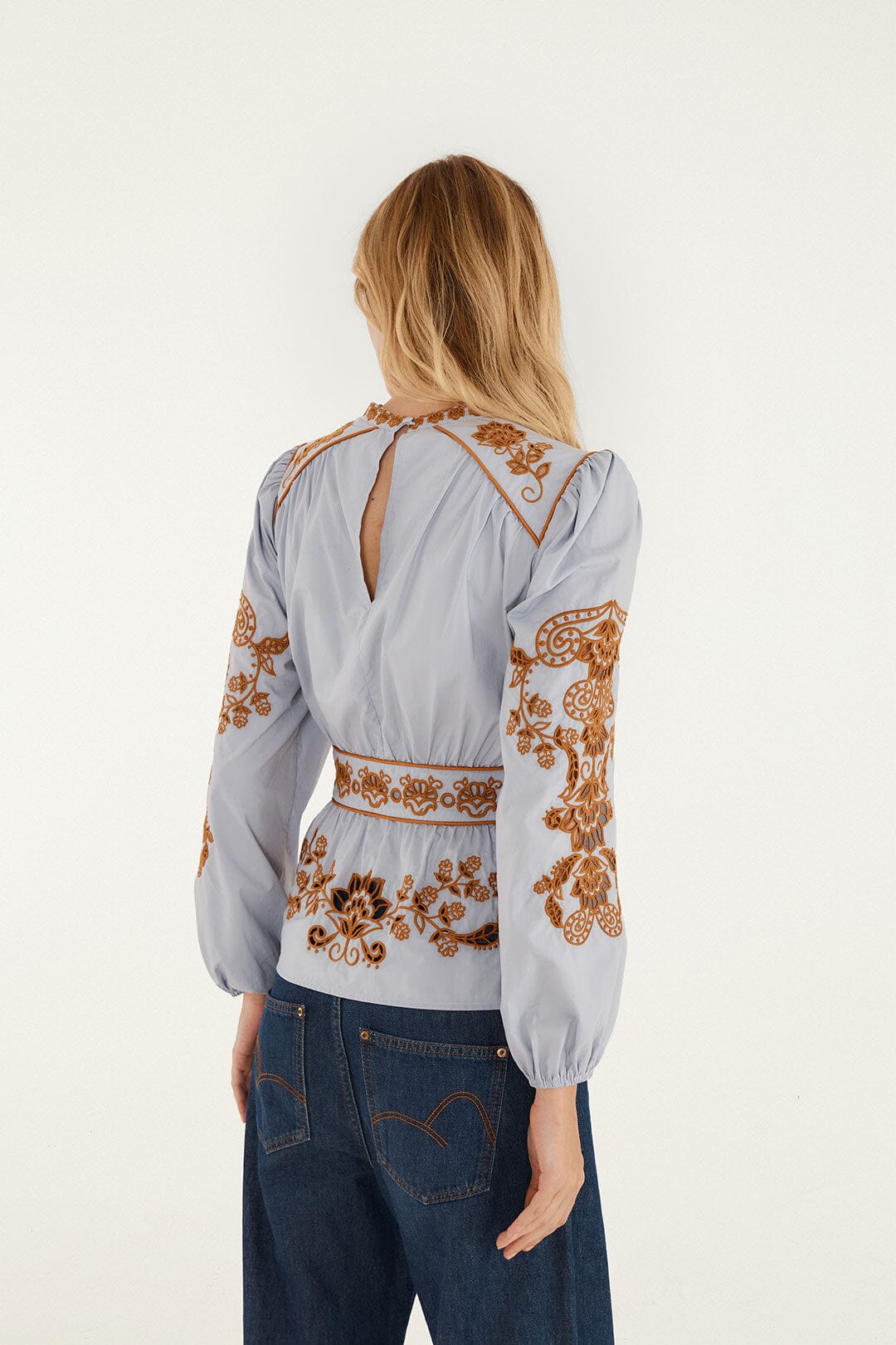 FARM Rio model wearing the Flower Richelieu Long Sleeve Blouse