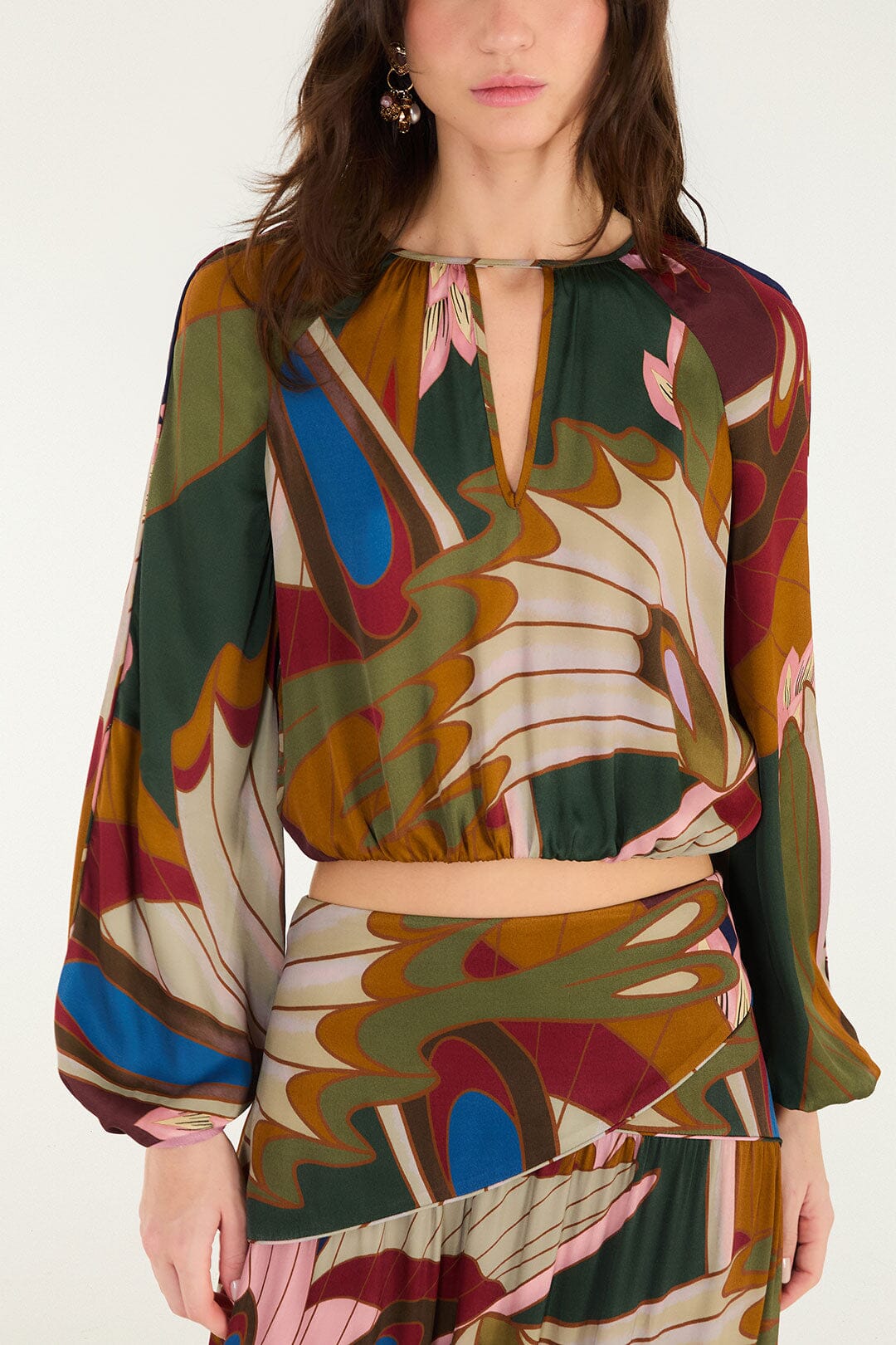 FARM Rio model wearing the Mystical Paradise Long Sleeve Blouse