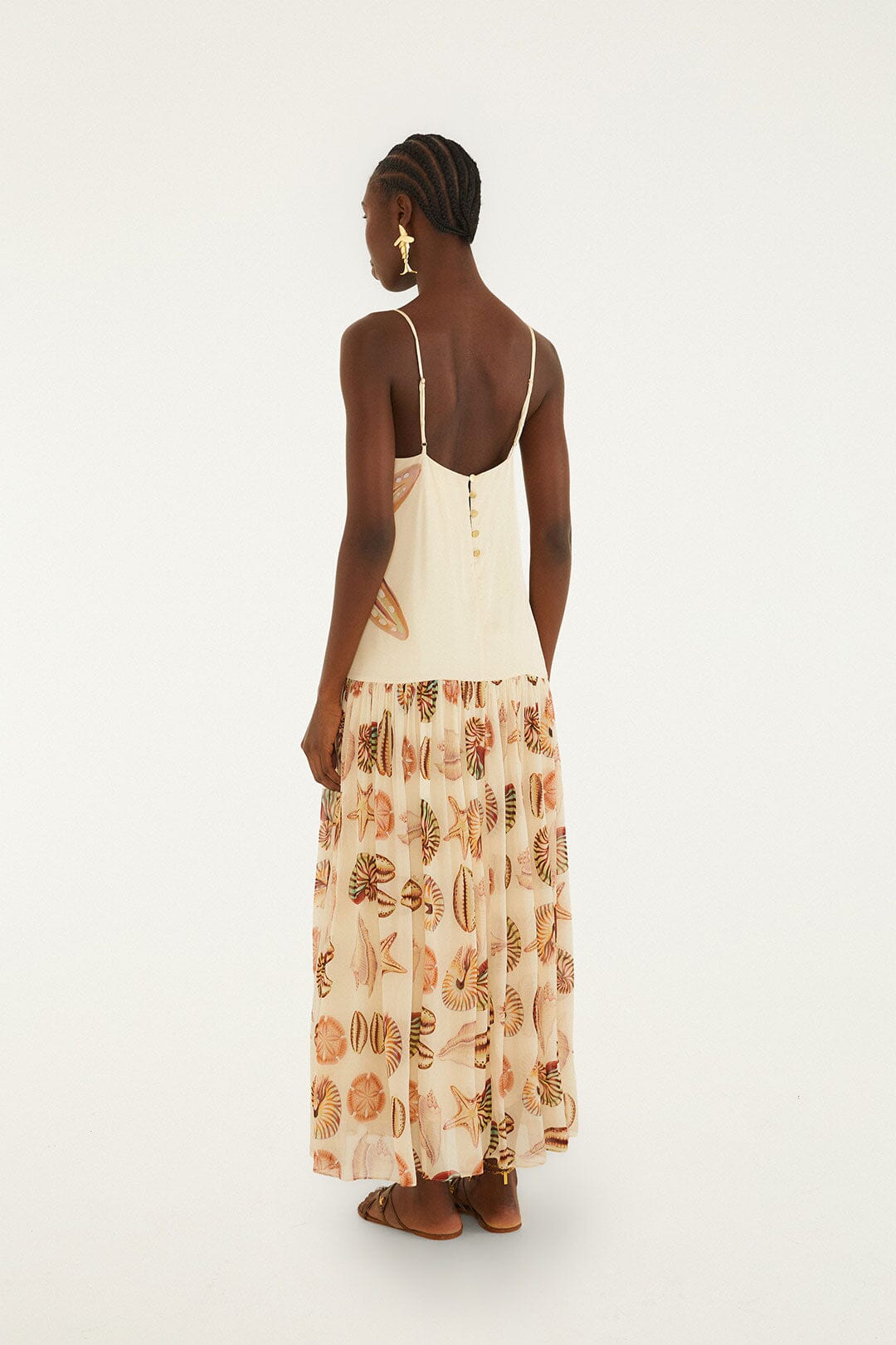 FARM Rio model wearing the Sand Marine Shells Pleated Sleeveless Maxi Dress