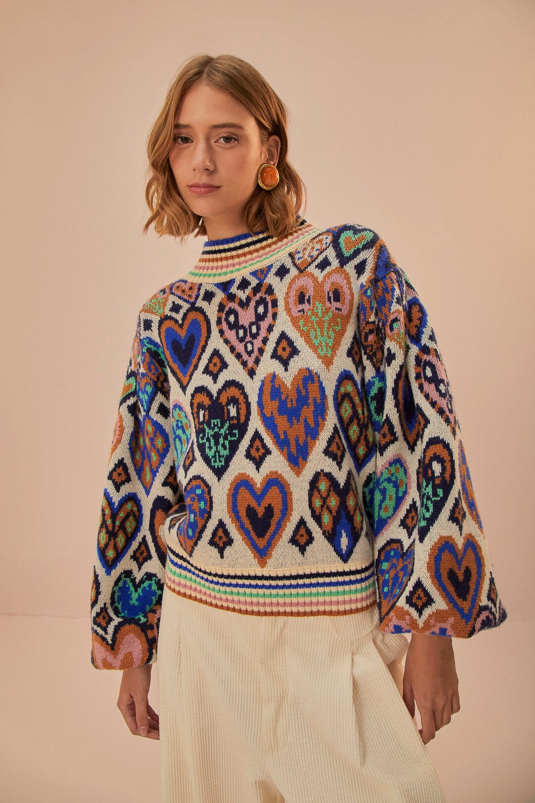 Pull en tricot ikat à coeurs crème