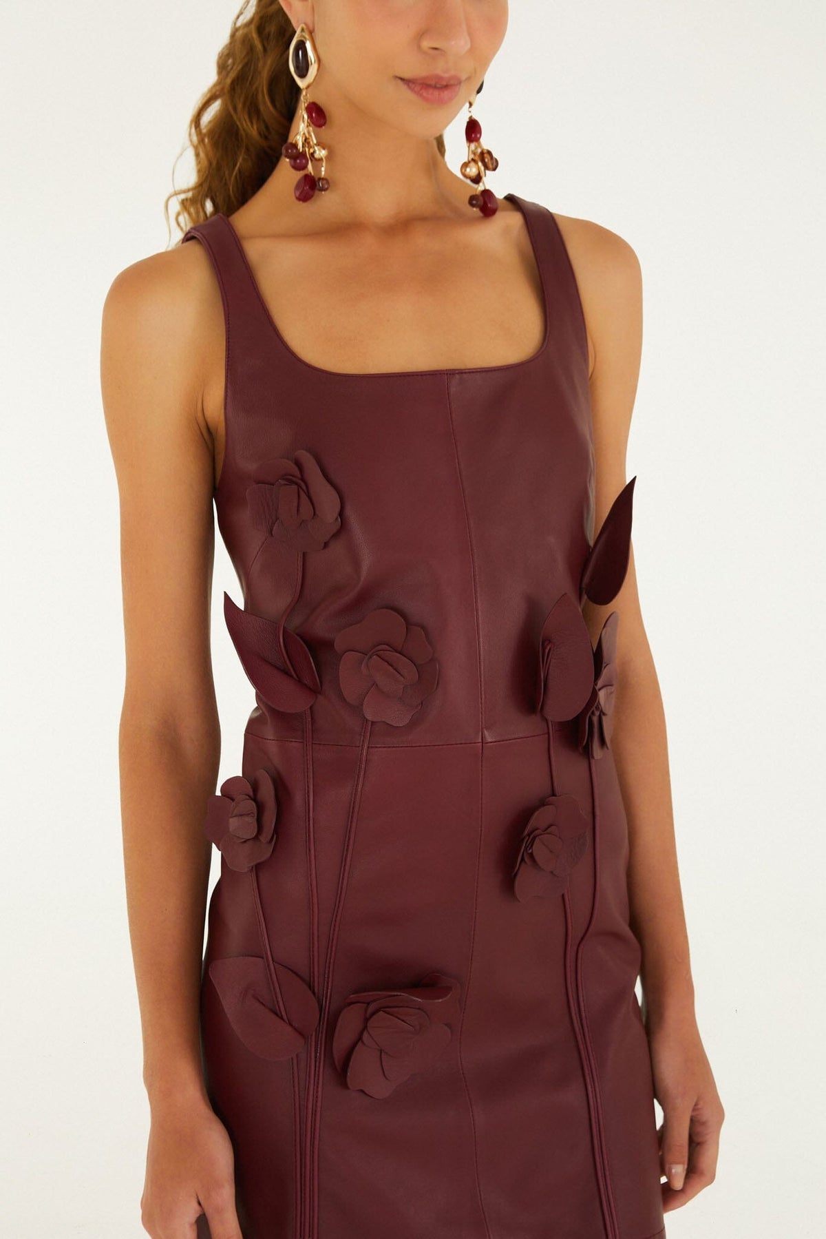 FARM Rio model wearing the 3d Flowers Sleeveless Leather Mini Dress
