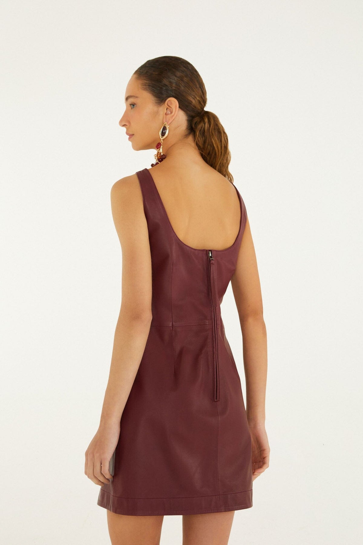 FARM Rio model wearing the 3d Flowers Sleeveless Leather Mini Dress