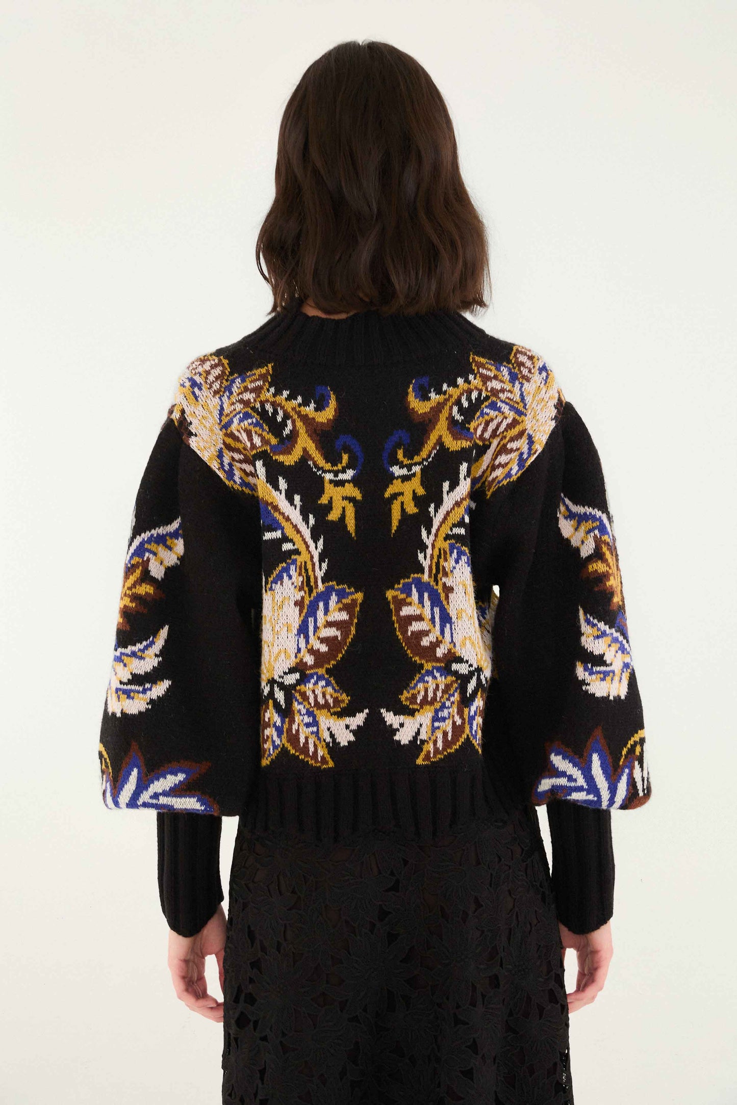 FARM Rio model wearing the Arabesque Paradise Knit Sweater