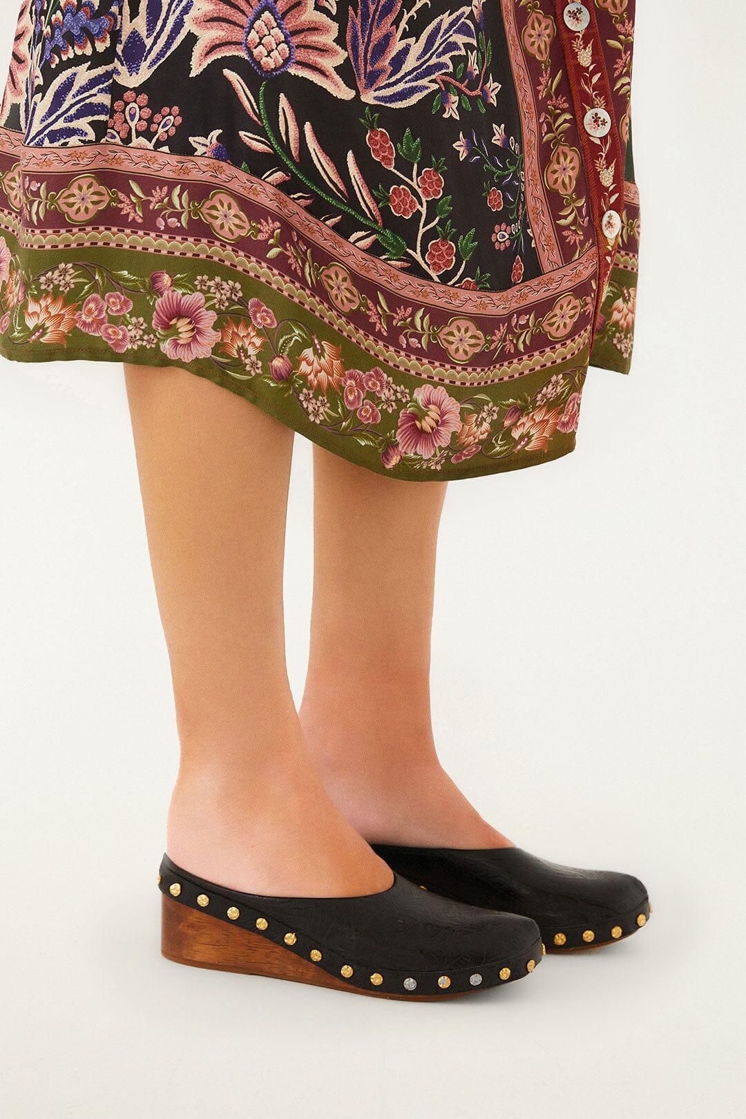 FARM Rio model wearing the Black Embossed Wedge Clog