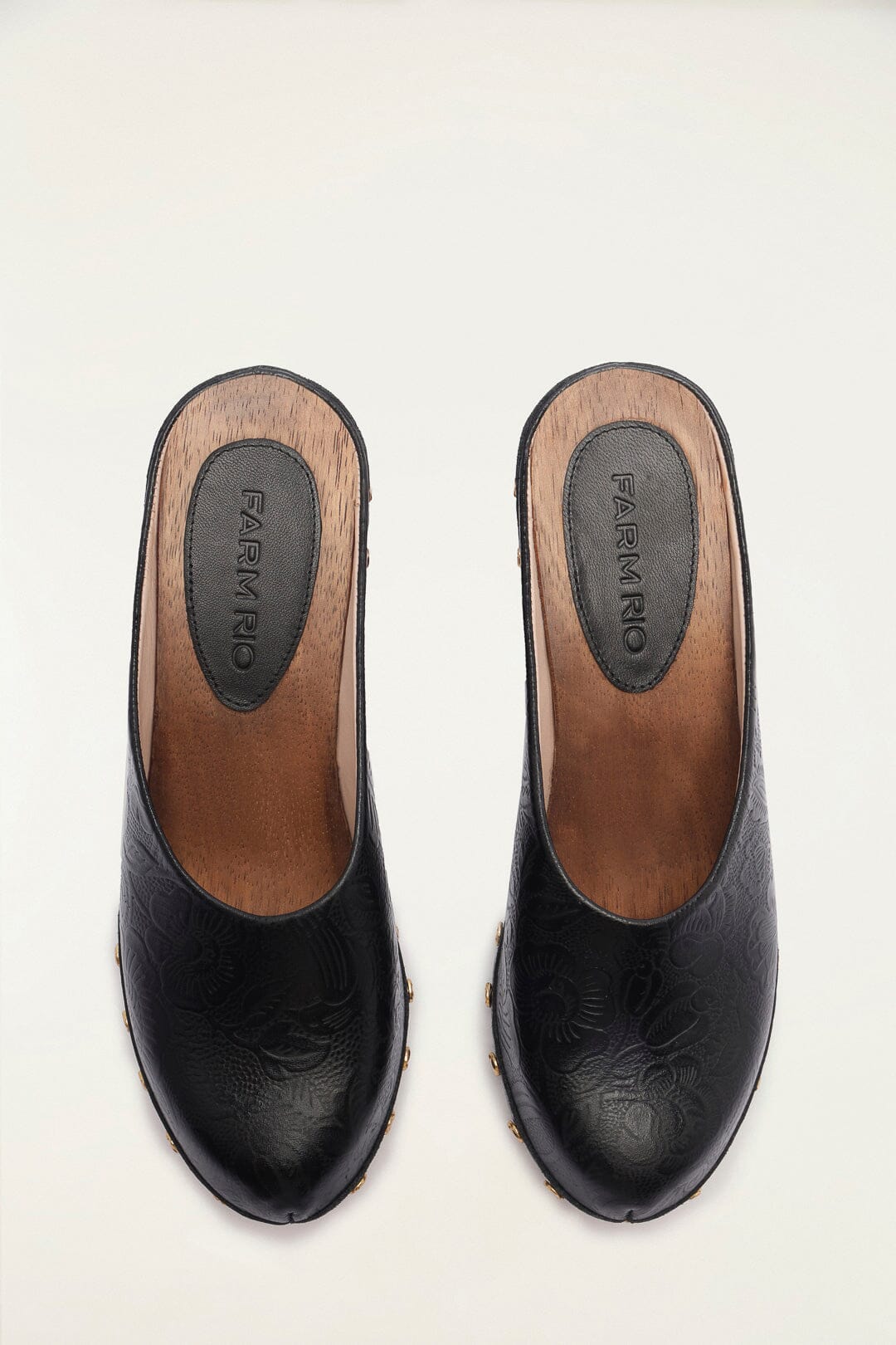 FARM Rio model wearing the Black Embossed Wedge Clog