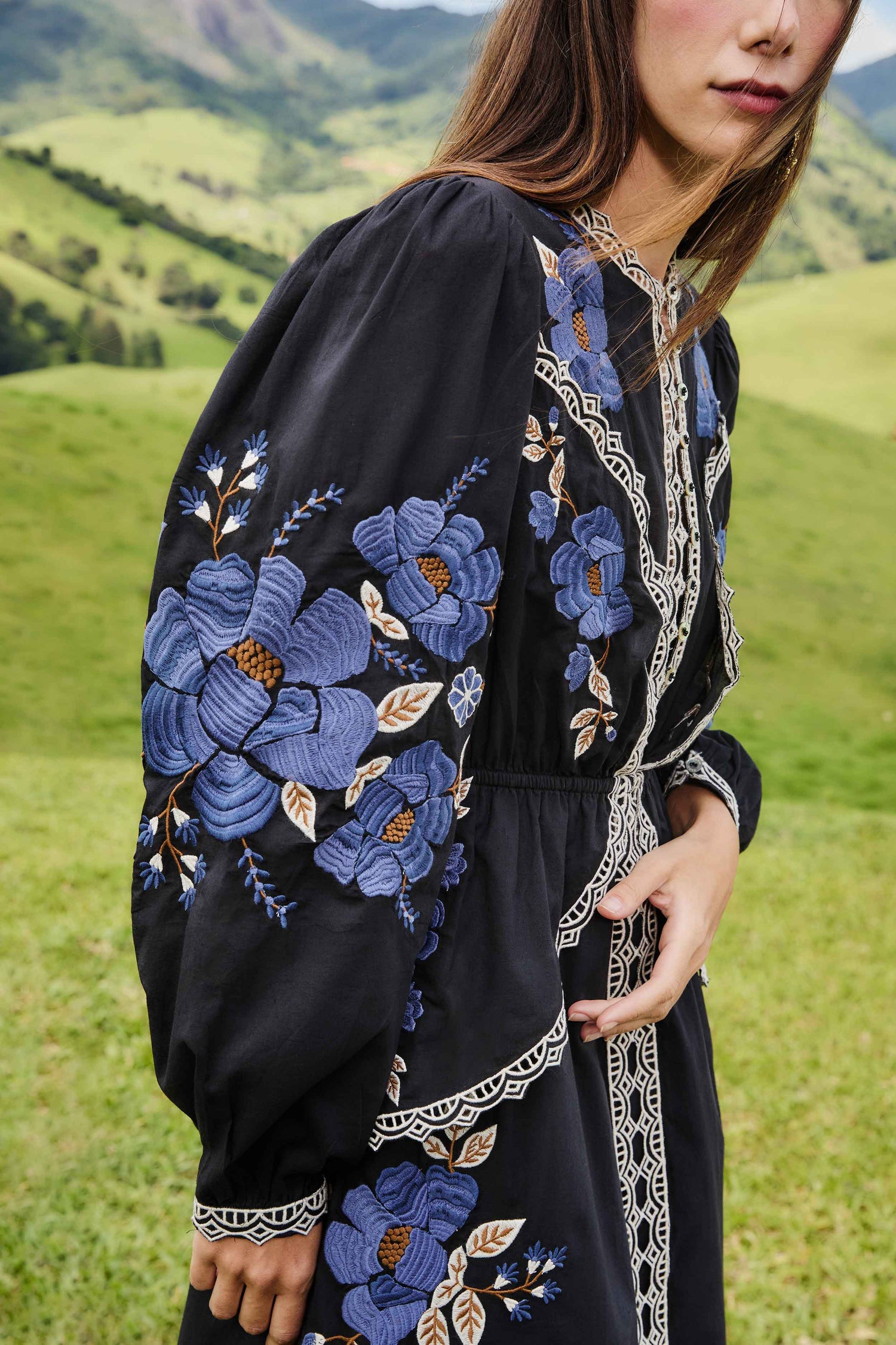 FARM Rio model wearing the Black Embroidered Flowers Long Sleeve Midi Dress