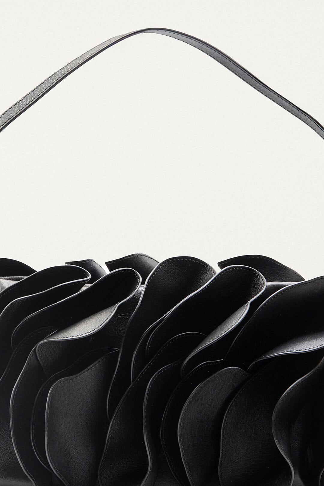 FARM Rio model wearing the Black Leather Shoulder Flower Bag