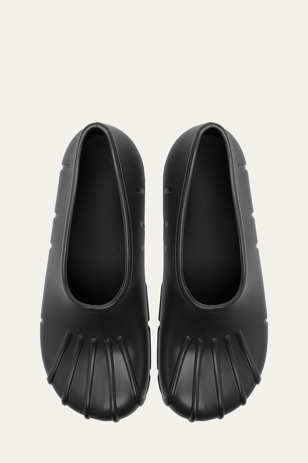 FARM Rio model wearing the Black Monstera Rain Shoe