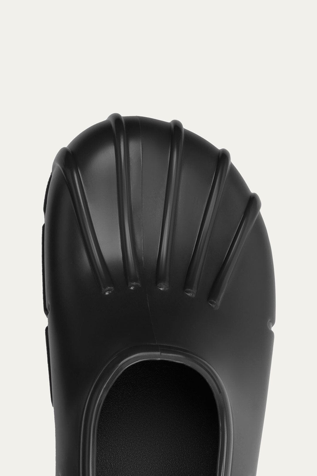 FARM Rio model wearing the Black Monstera Rain Shoe