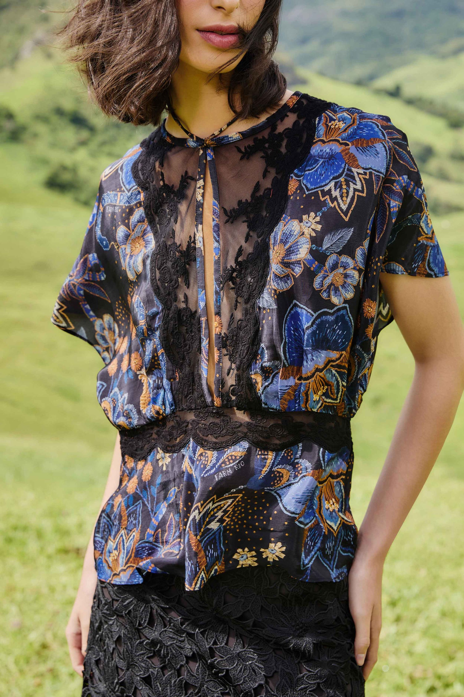 FARM Rio model wearing the Black Snakes Bouquet Blouse