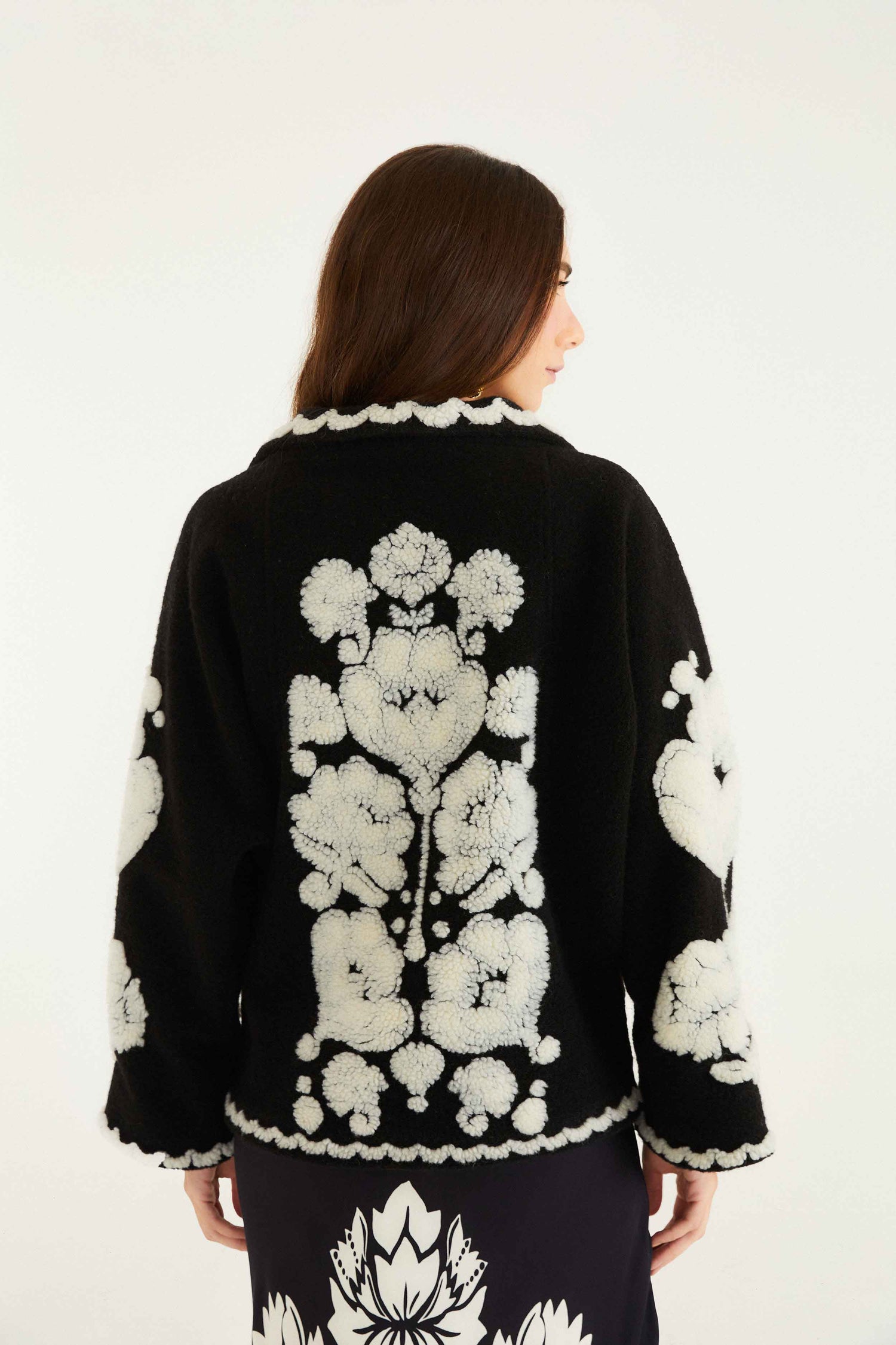 FARM Rio model wearing the Black & White Floral Arabesque Fleece Coat