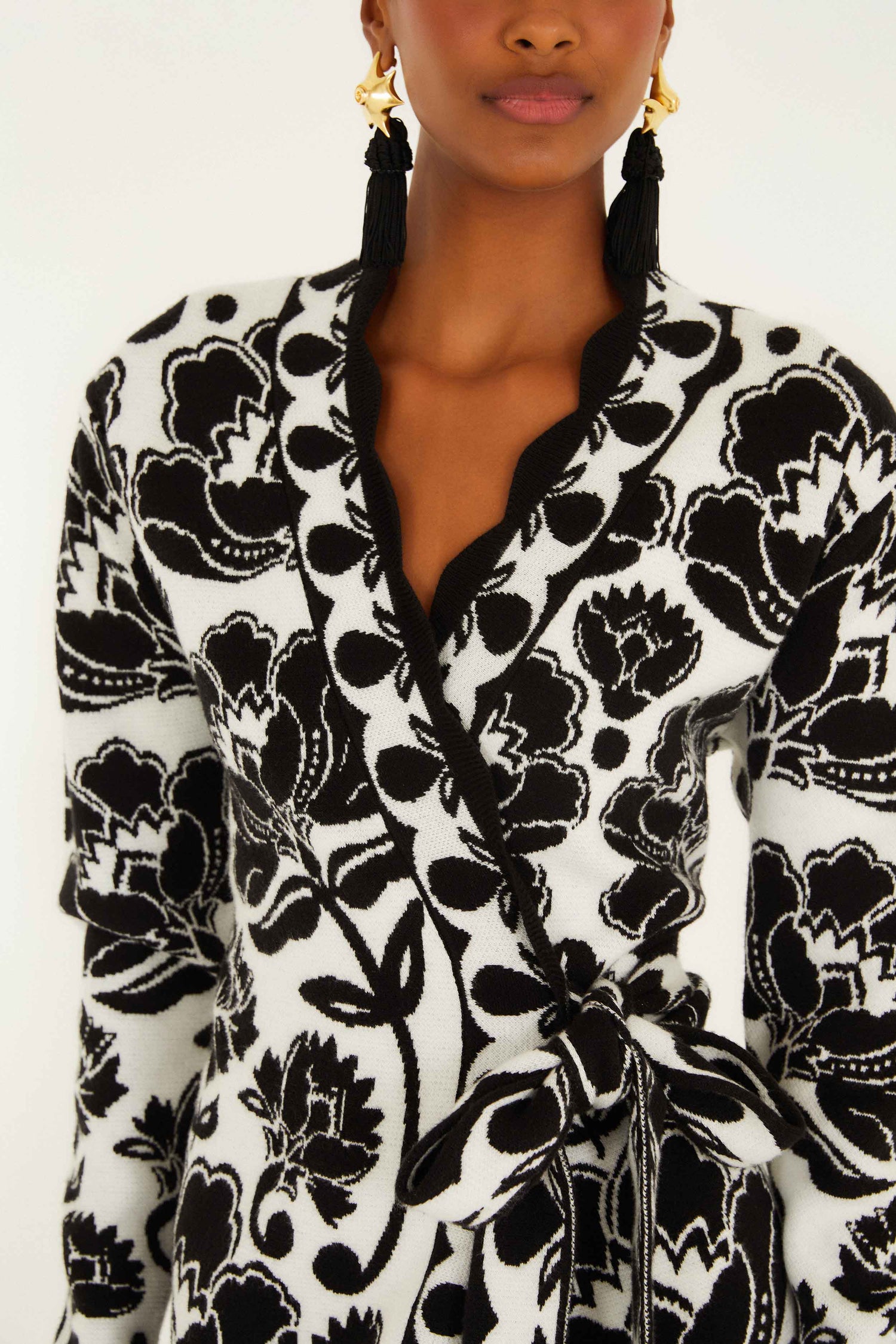FARM Rio model wearing the Black & White Floral Arabesque Knit Wrap Dress