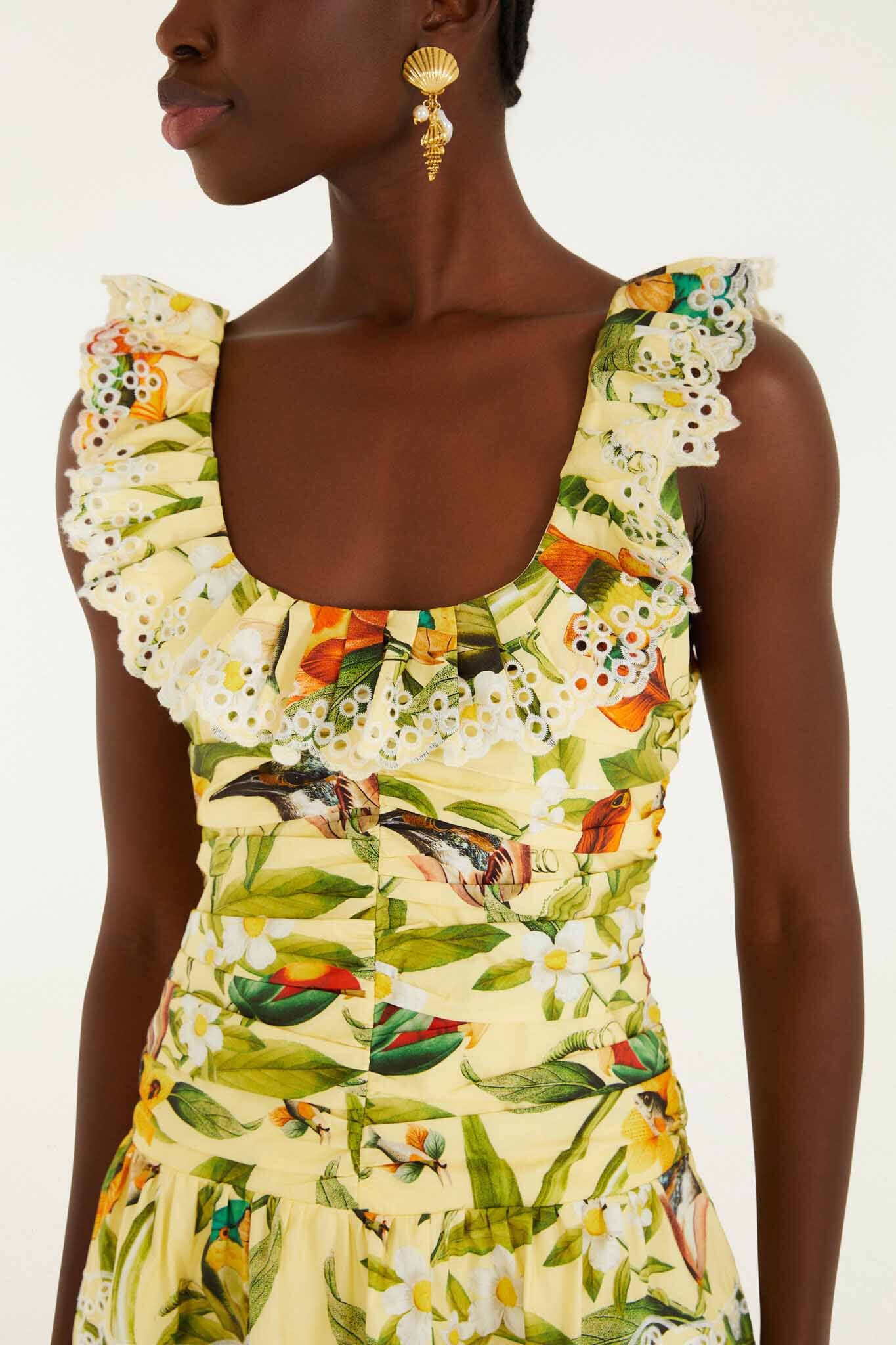 FARM Rio model wearing the Brasil Collage Soft Yellow Mini Dress