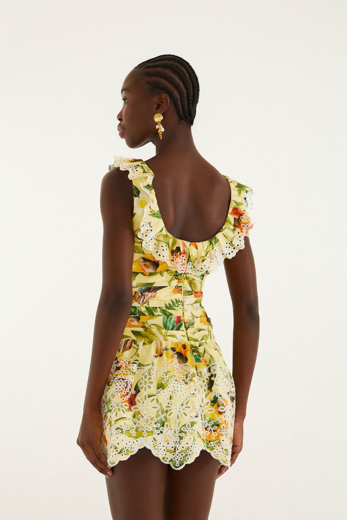 FARM Rio model wearing the Brasil Collage Soft Yellow Mini Dress