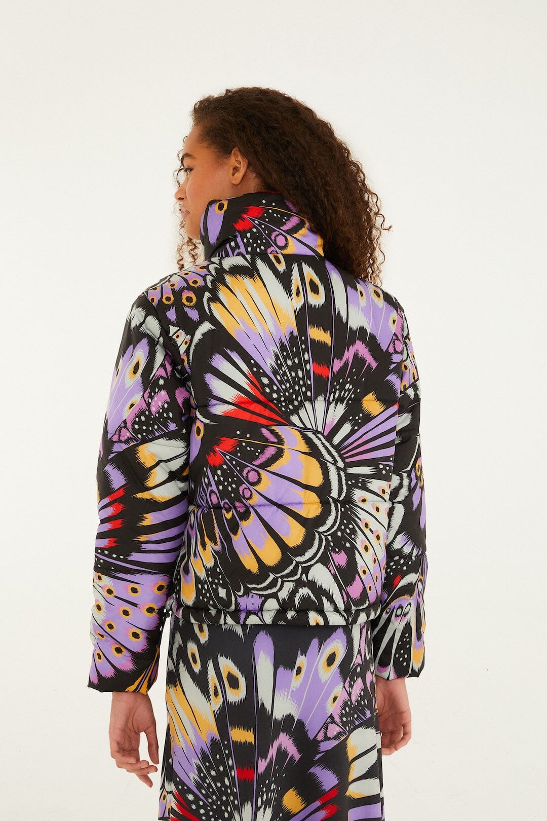 FARM Rio model wearing the Colorfly Lilac Adidas Puffer Jacket