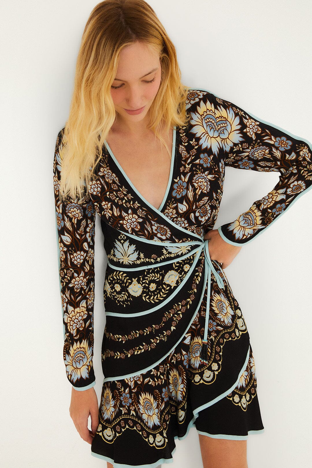 FARM Rio model wearing the Daniela Long Sleeve Wrap Mini Dress