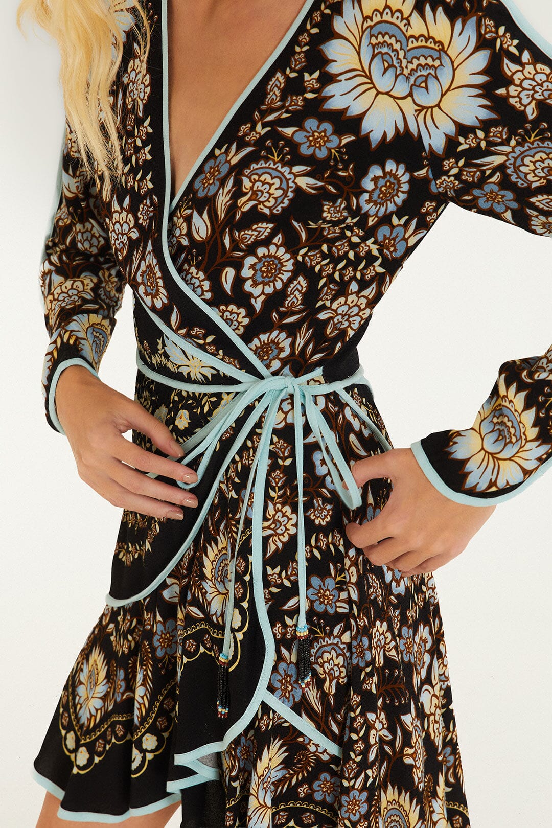 FARM Rio model wearing the Daniela Long Sleeve Wrap Mini Dress