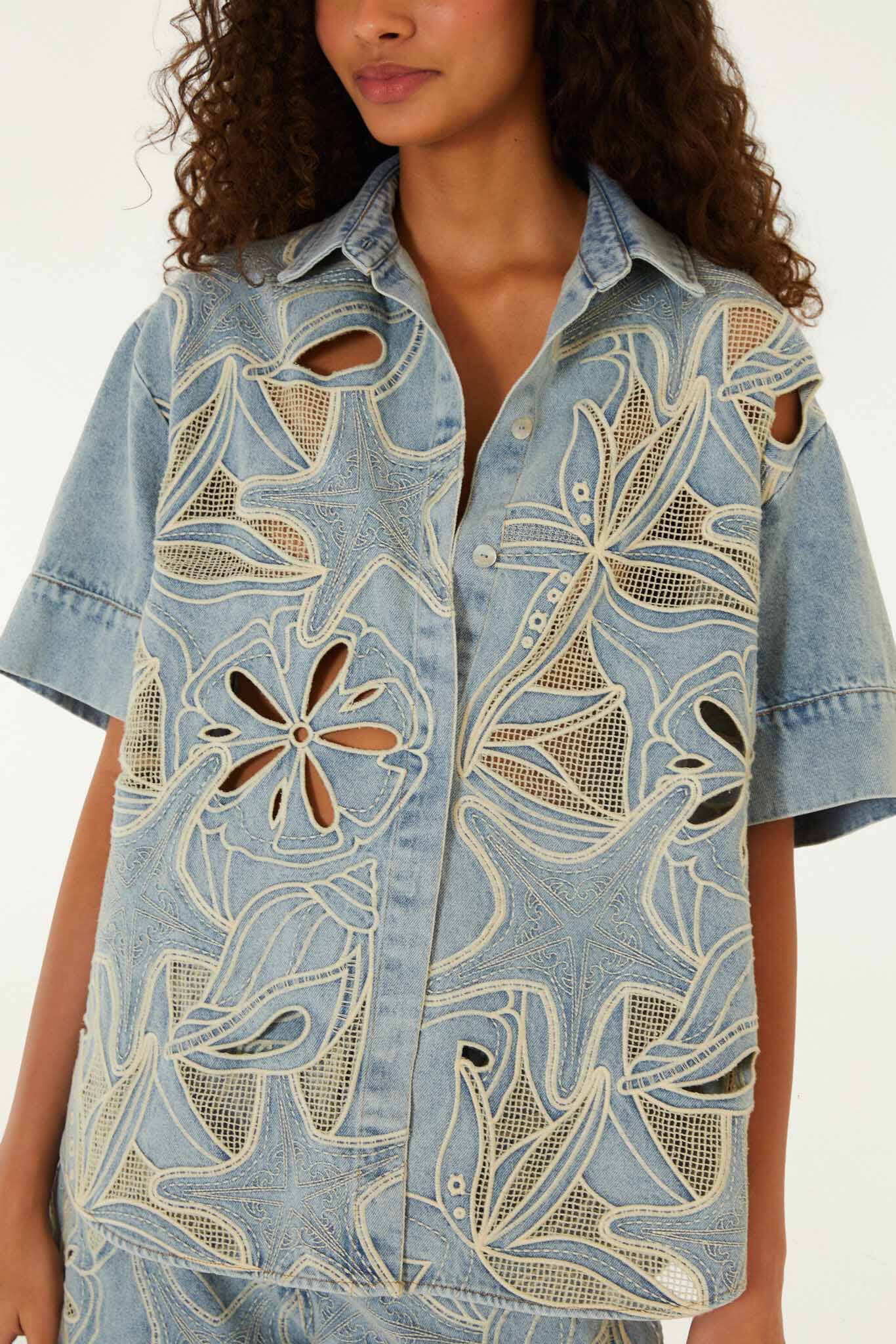 FARM Rio model wearing the Denim Sea Desire Embroidered Short Sleeve Shirt