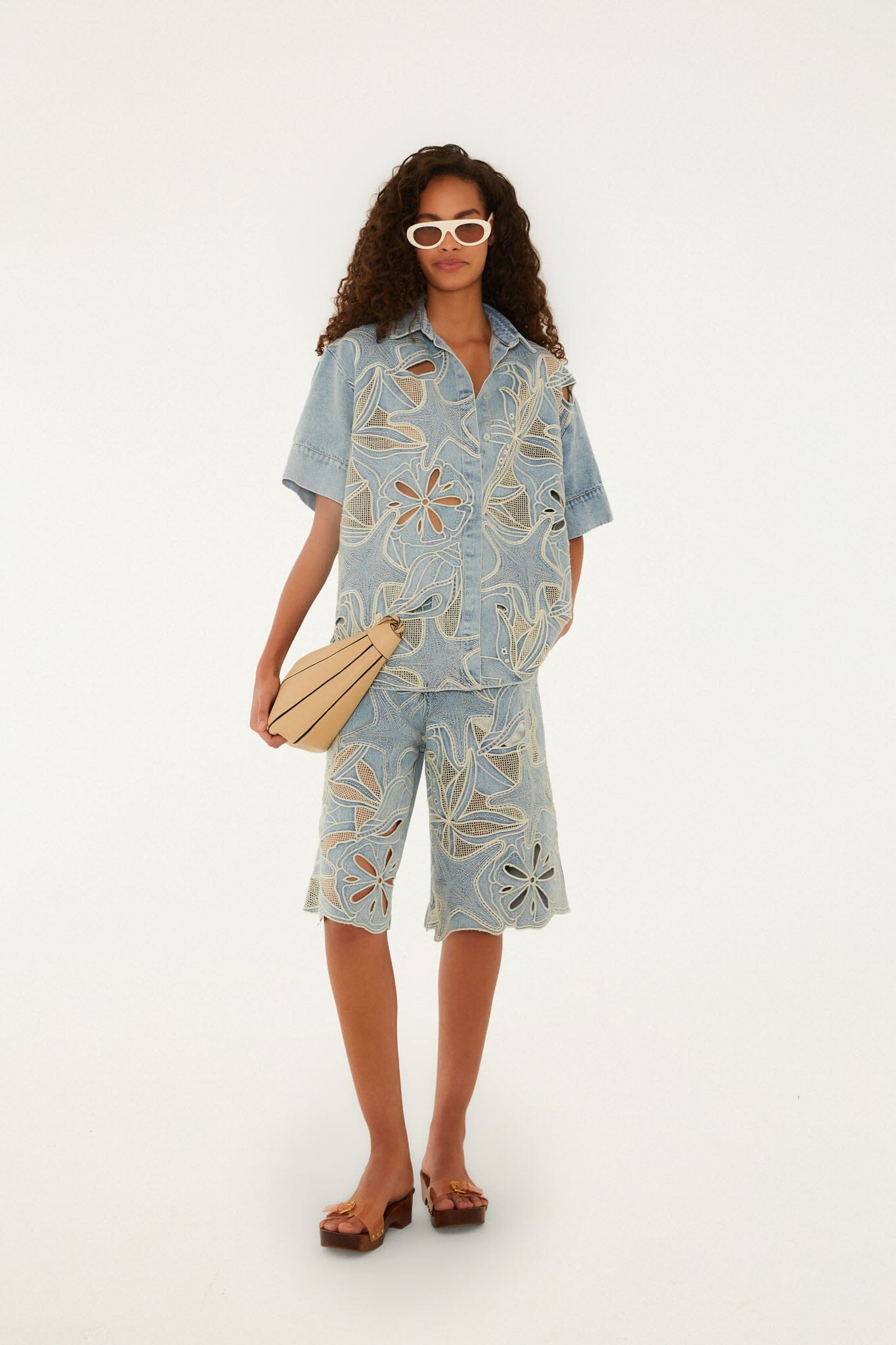 FARM Rio model wearing the Denim Sea Desire Embroidered Short Sleeve Shirt