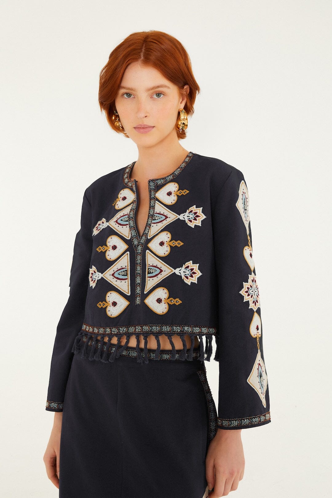 FARM Rio model wearing the Embroidered Long Sleeve Fringe Crop Top