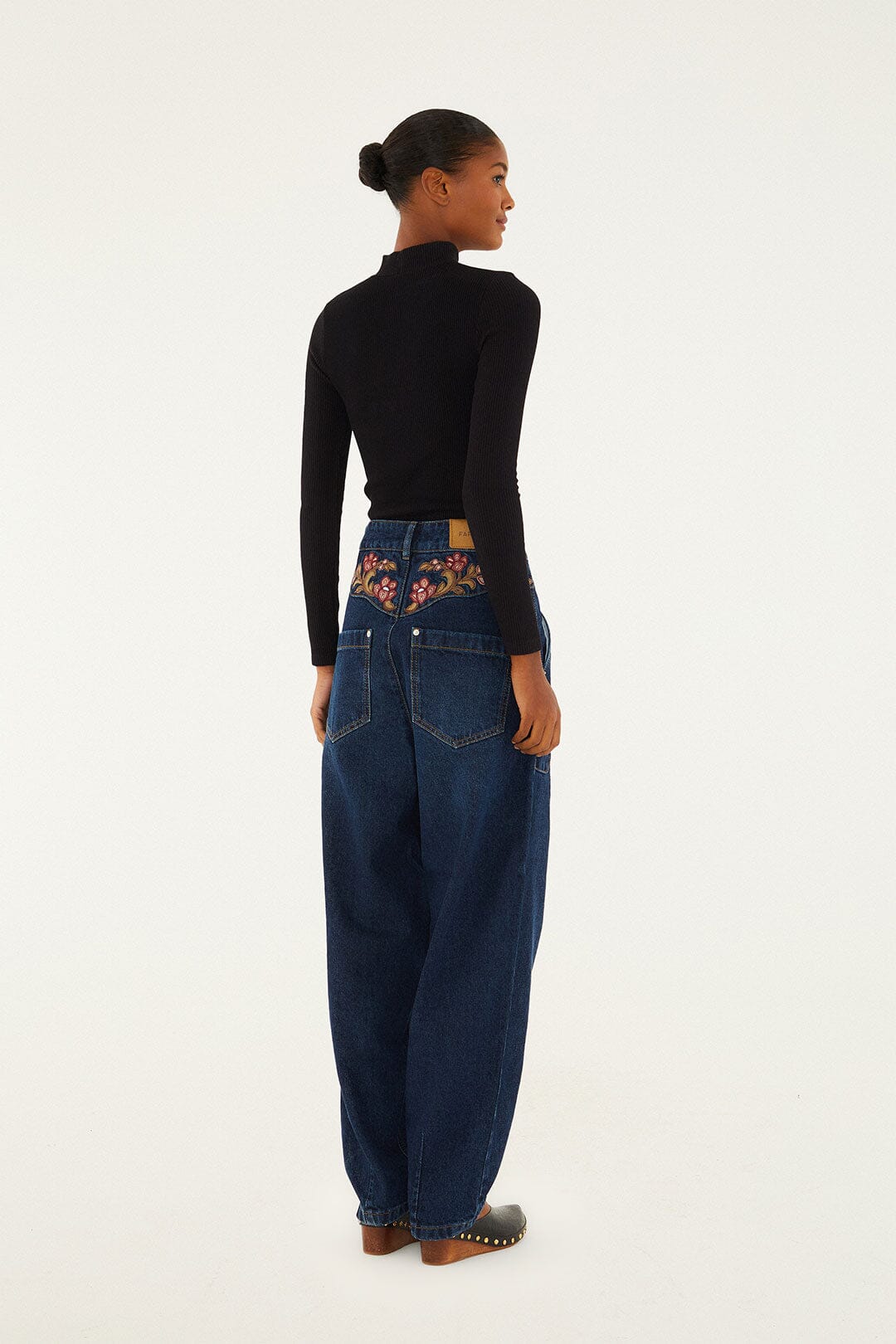 FARM Rio model wearing the Floral Embroidery Denim Pants