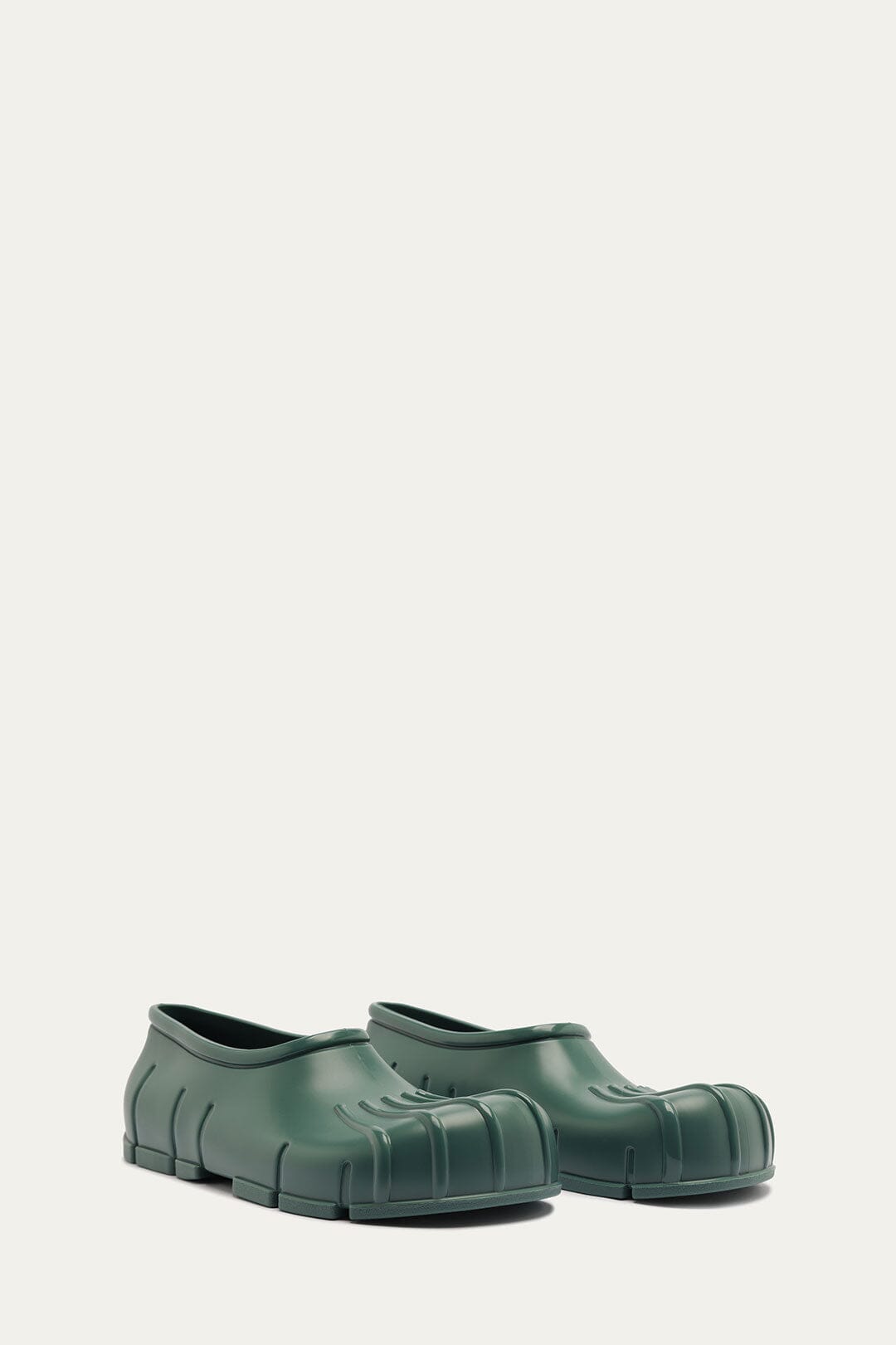 FARM Rio model wearing the Forest Green Monstera Rain Shoe