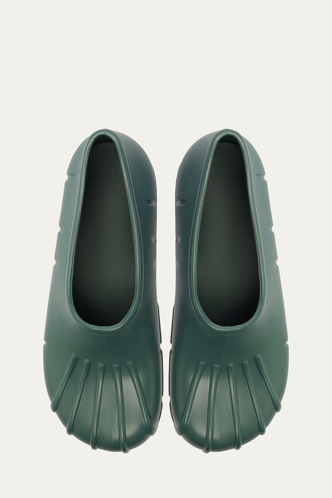 FARM Rio model wearing the Forest Green Monstera Rain Shoe