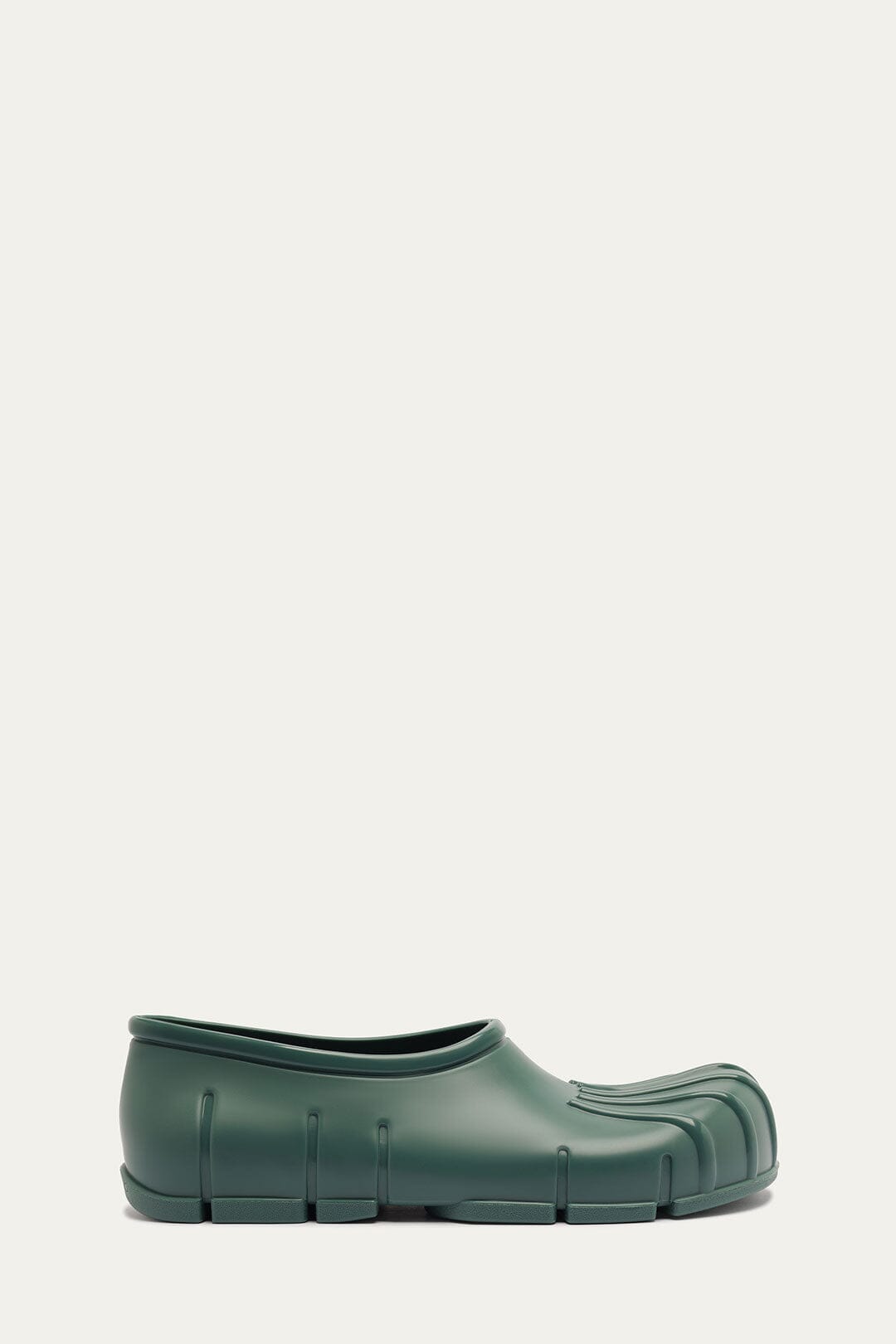 FARM Rio model wearing the Forest Green Monstera Rain Shoe