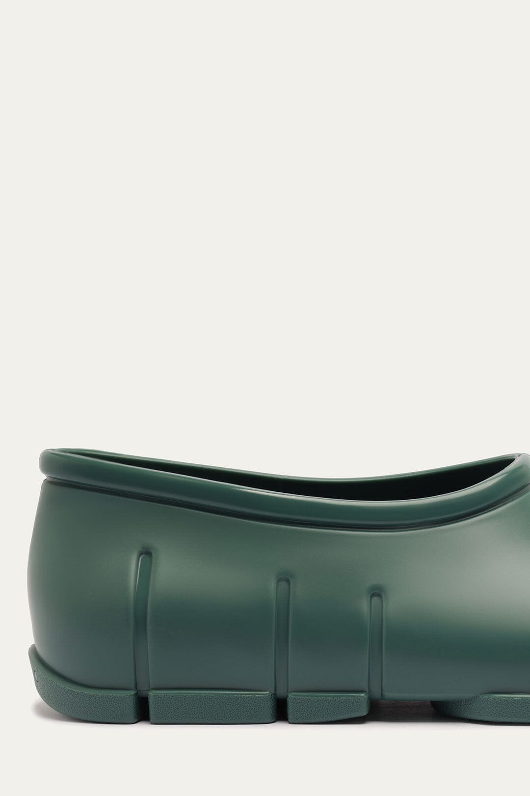 FARM Rio model wearing the Forest Green Monstera Rain Shoe
