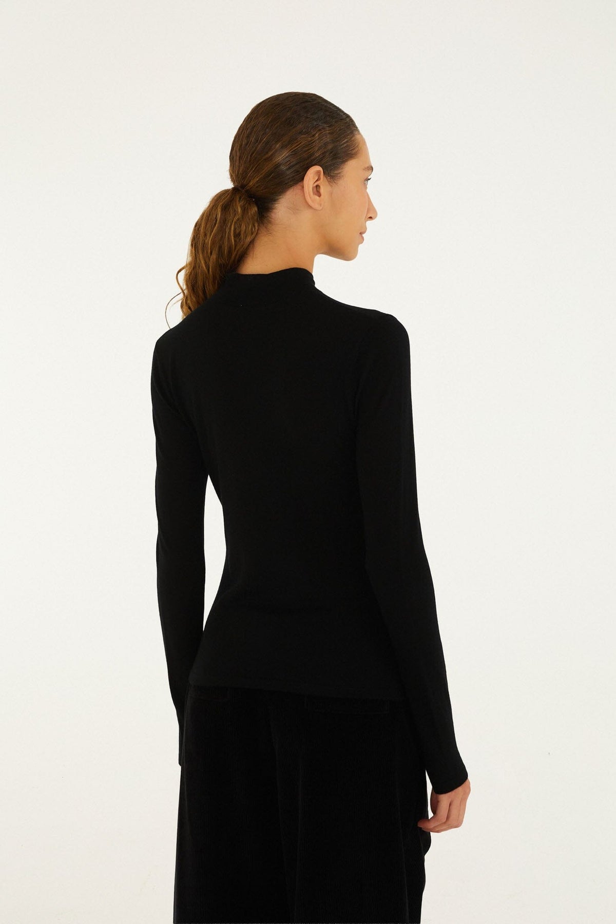 FARM Rio model wearing the Knit Turtleneck Top