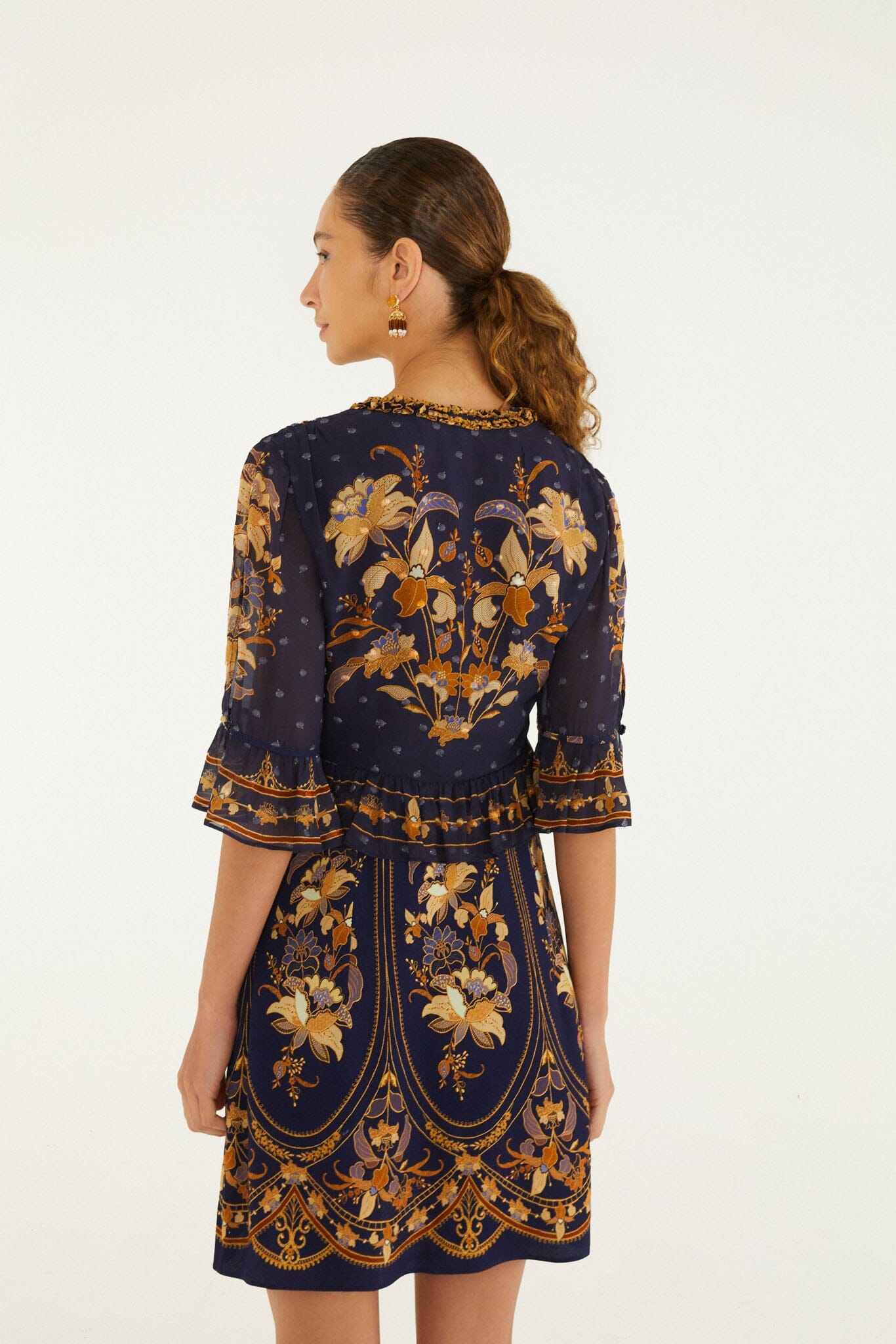 FARM Rio model wearing the Liz Ruffled Short Sleeve Mini Dress