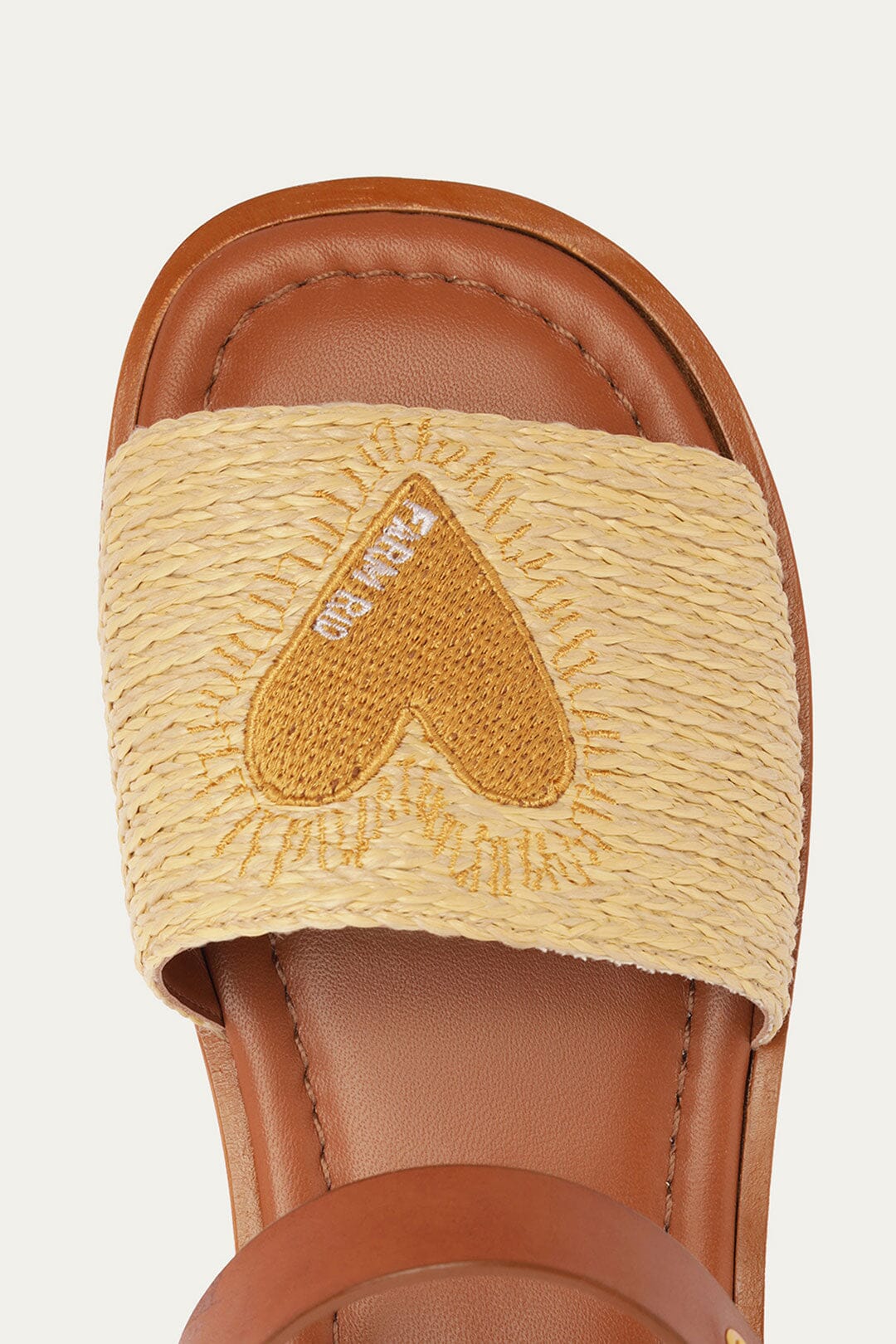 FARM Rio model wearing the Raffia Flat Sandal