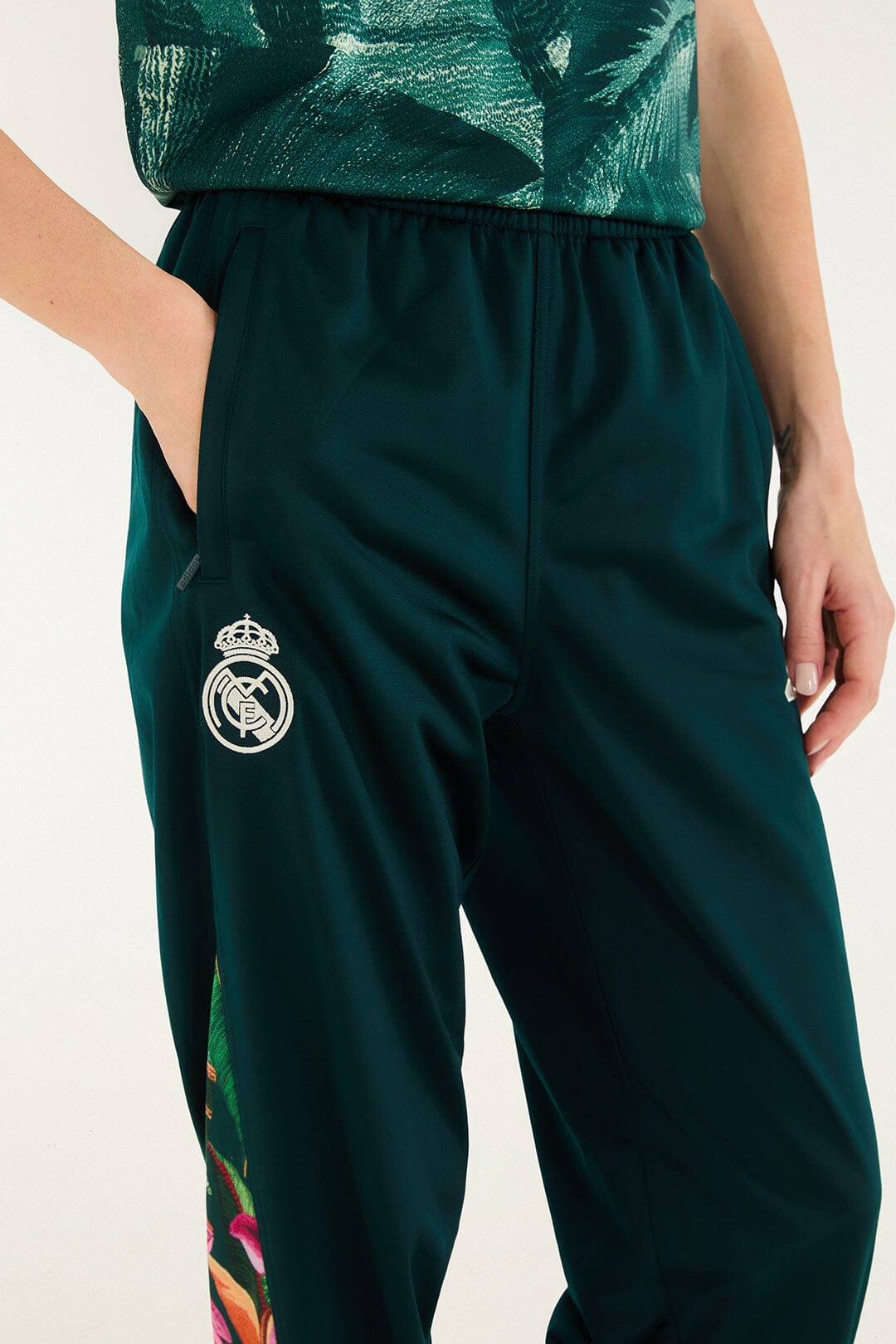 FARM Rio model wearing the Real Foliage Green Adidas Pants