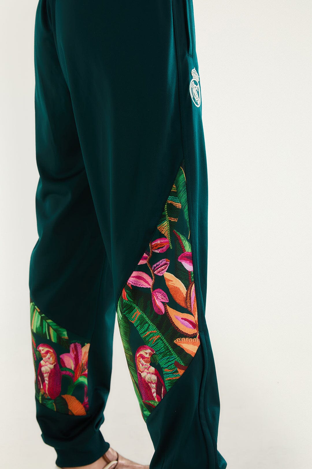 FARM Rio model wearing the Real Foliage Green Adidas Pants