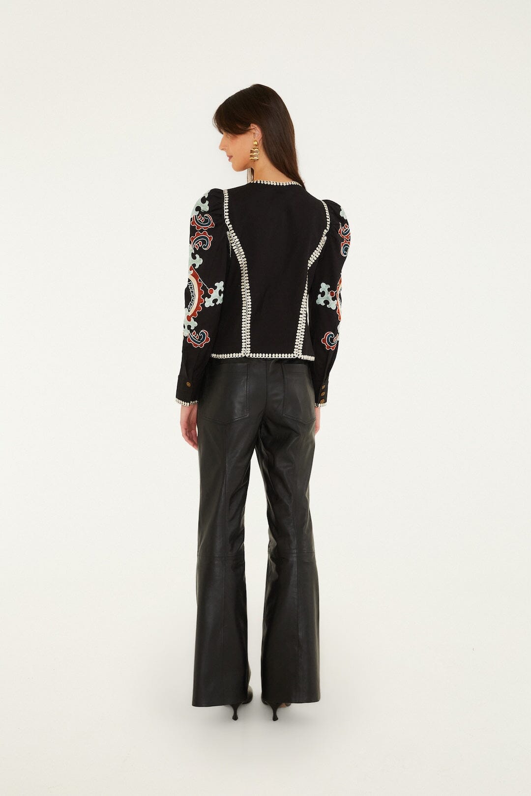 FARM Rio model wearing the Riveted Wide-Leg Leather Trousers
