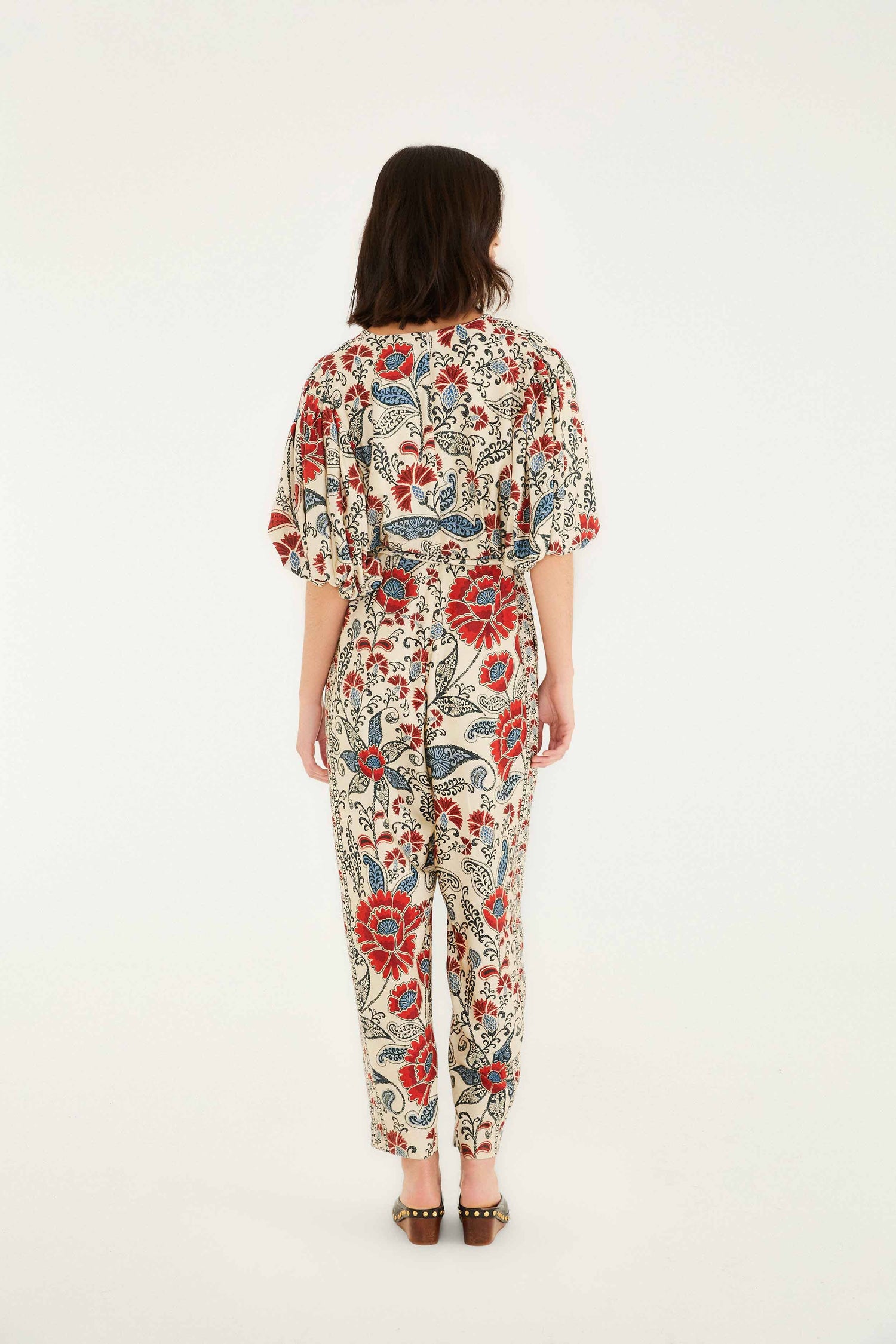 FARM Rio model wearing the Sand Francesca V Neckline Short Sleeve Jumpsuit