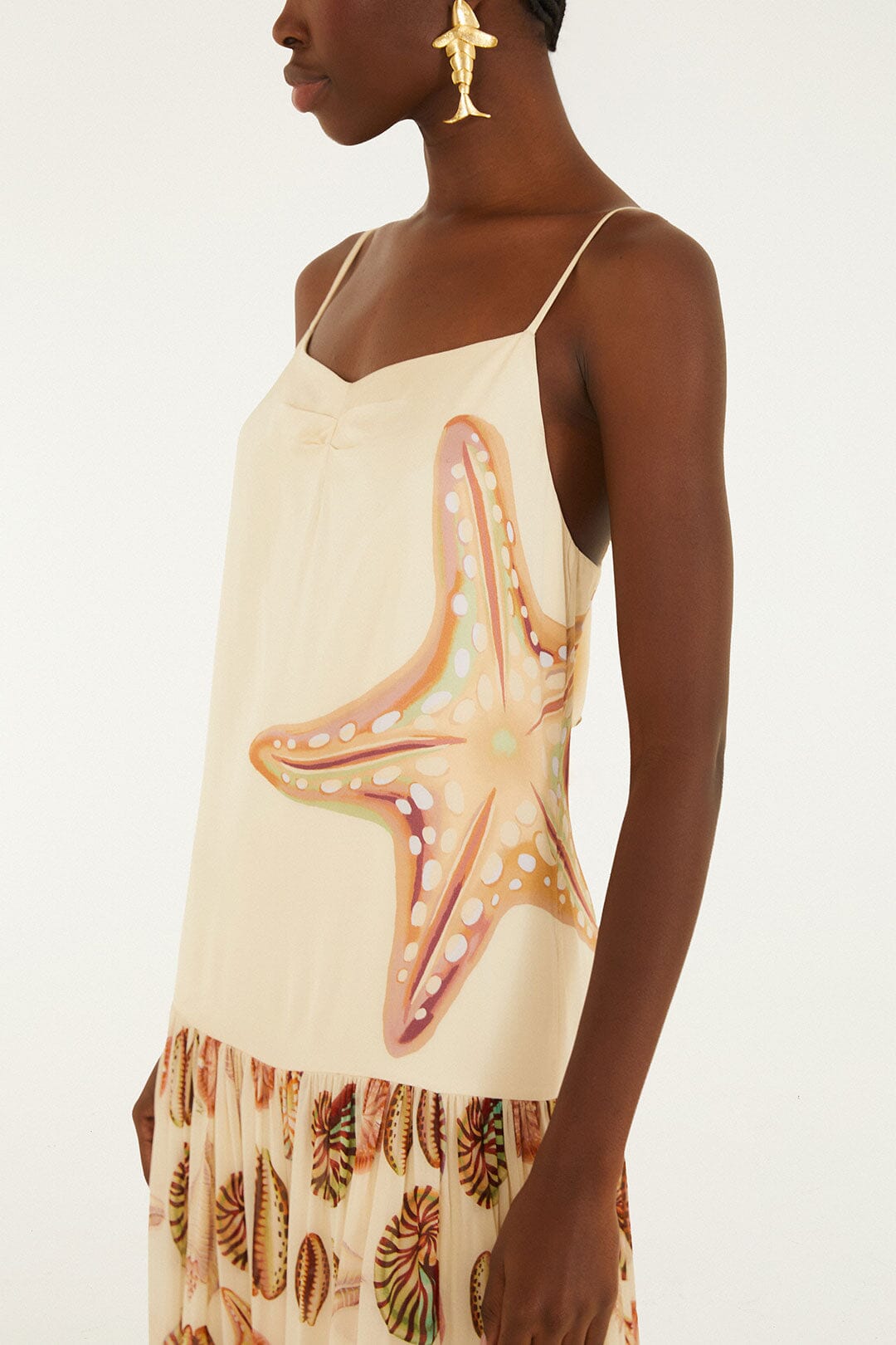 FARM Rio model wearing the Sand Marine Shells Pleated Sleeveless Maxi Dress