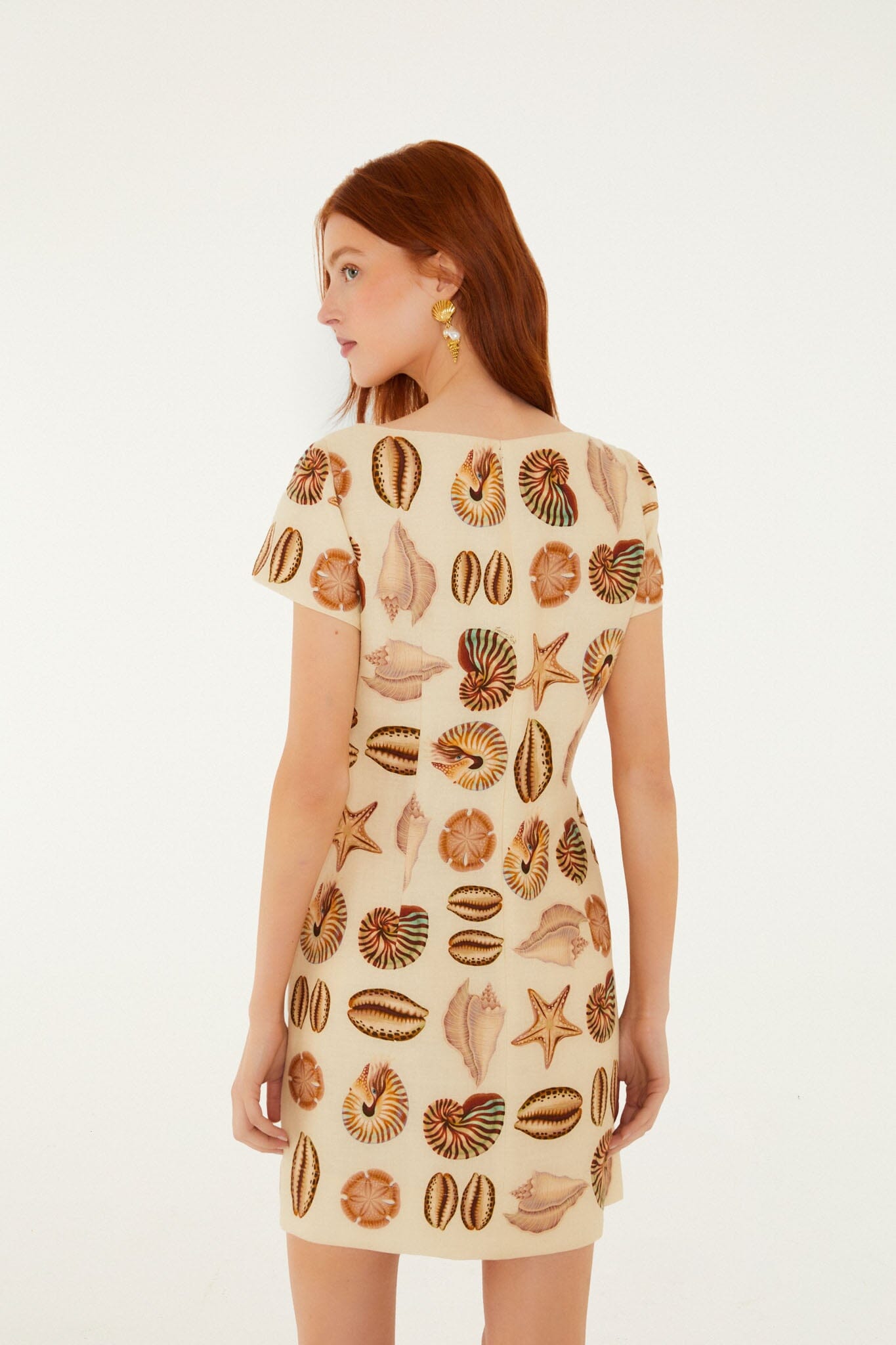 FARM Rio model wearing the Sand Marine Shells Short Sleeve Mini Dress