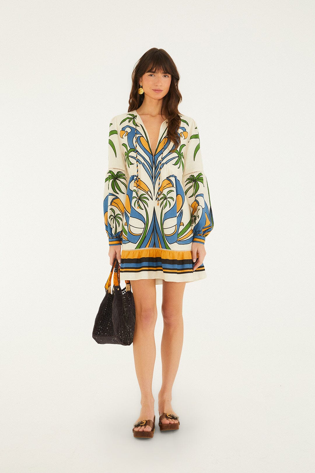 FARM Rio model wearing the Sand Tropical Graphic Lace Ruffled Mini Dress