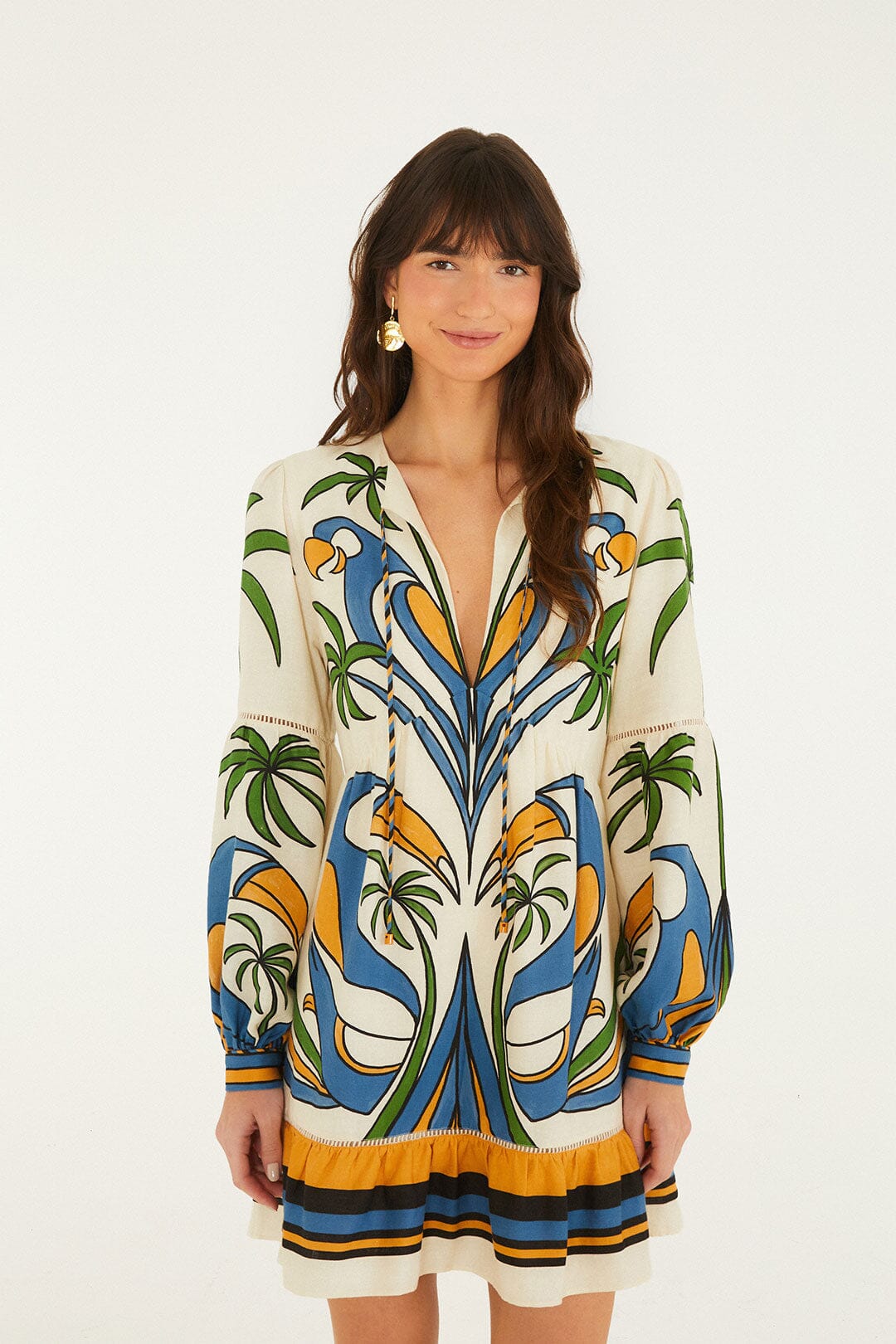 FARM Rio model wearing the Sand Tropical Graphic Lace Ruffled Mini Dress