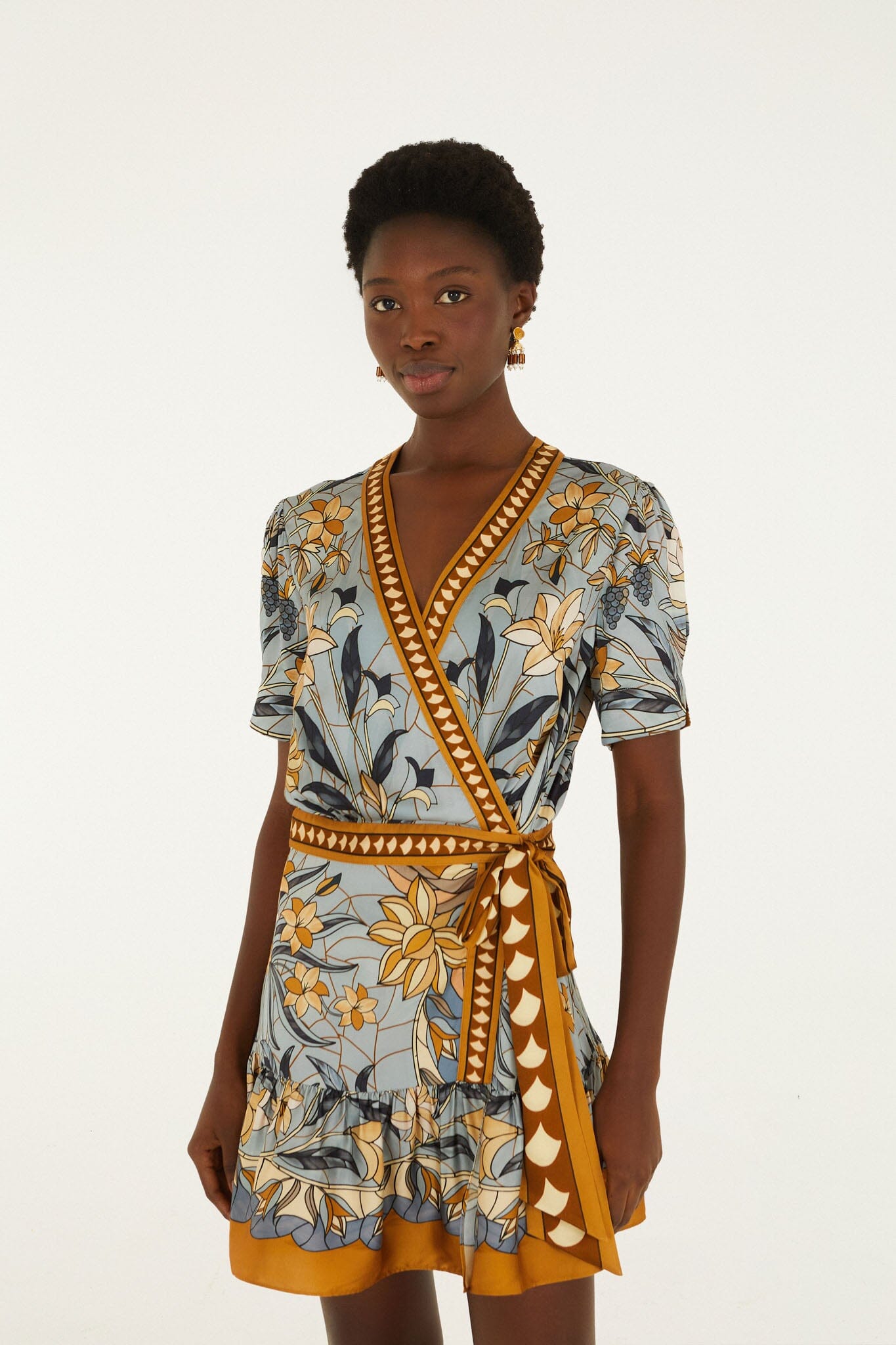 FARM Rio model wearing the Stained Glass Beauty Wrap Mini Dress