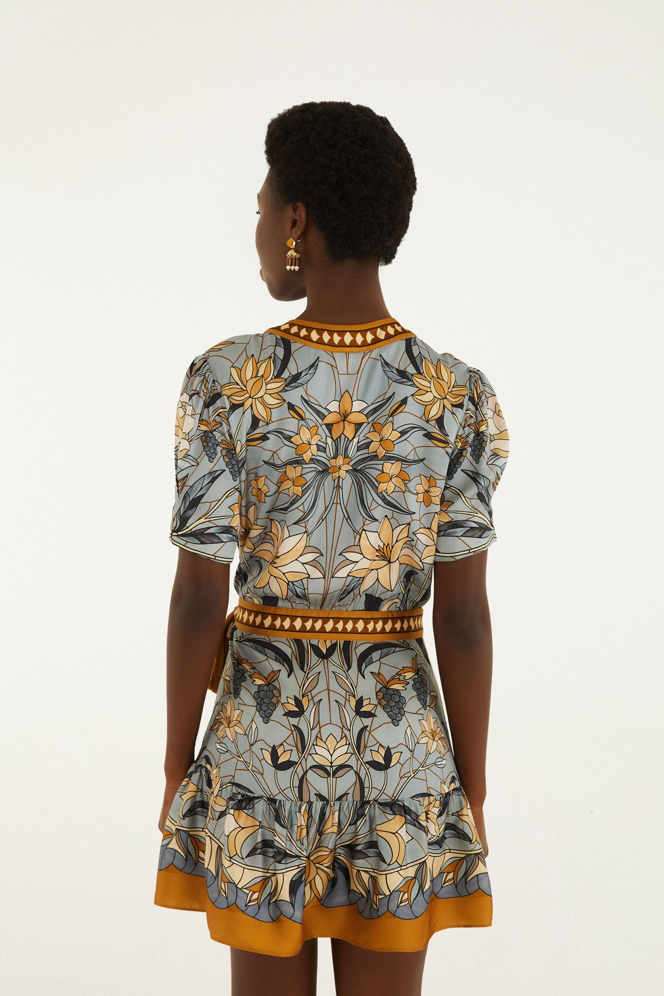 FARM Rio model wearing the Stained Glass Beauty Wrap Mini Dress