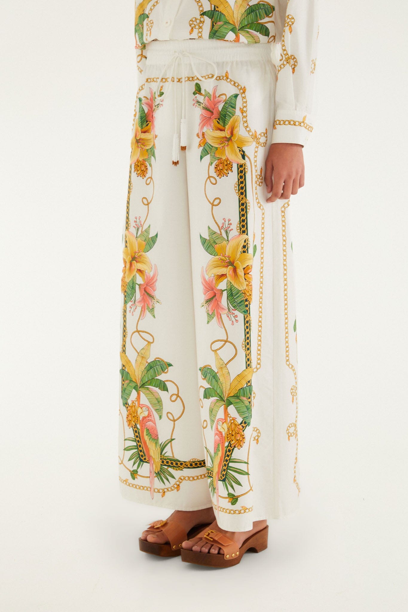 FARM Rio model wearing the Tropical Royalty Off-White Pants