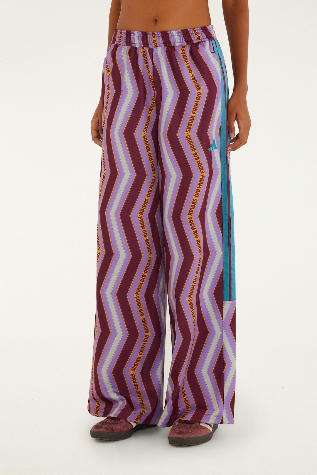 FARM Rio model wearing the Zig Zag Stripes Lilac Adidas Tiro Pants